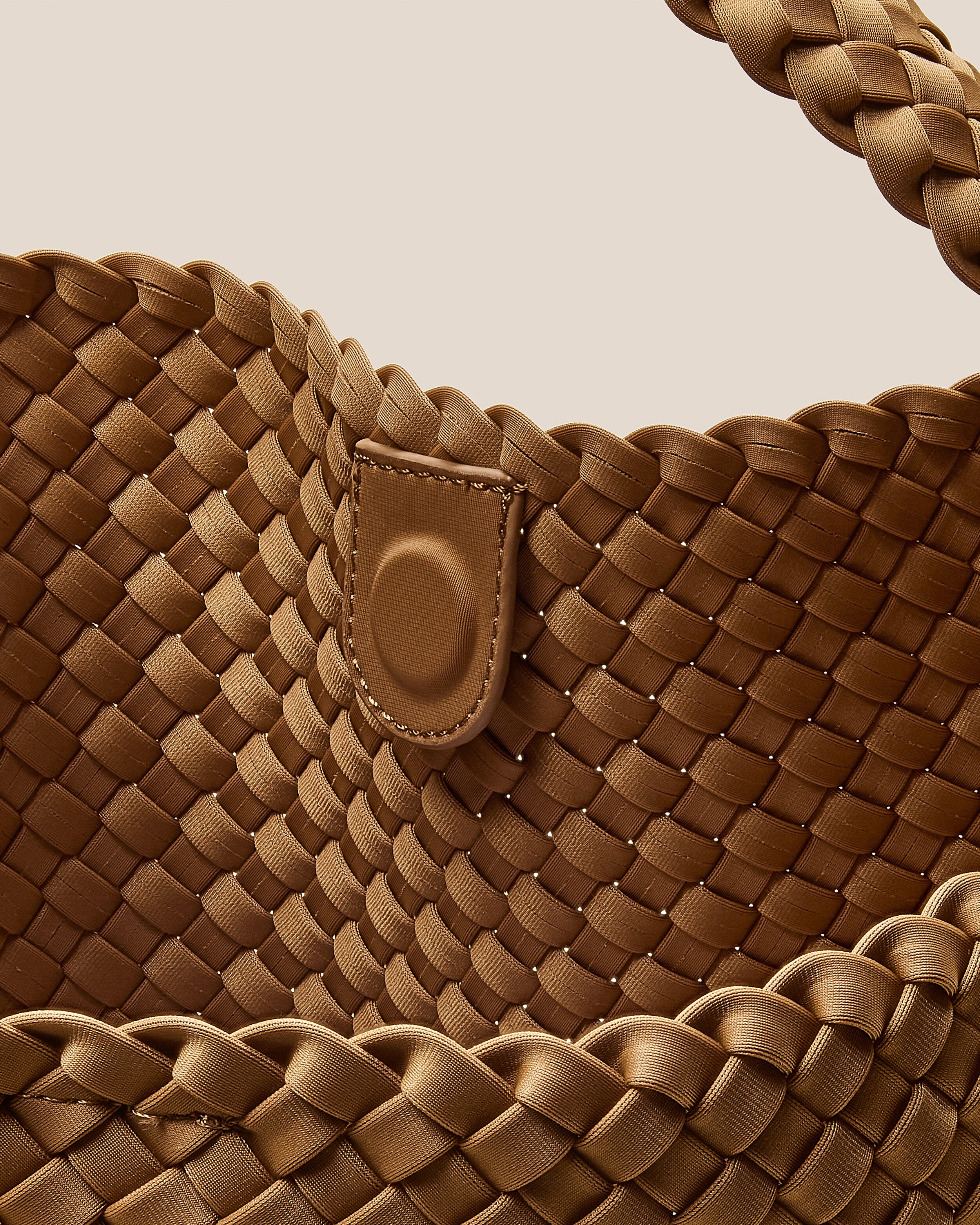 Interior close-up of Nomad Hobo in Montauk showing its open top with magnetic snap closure, and unlined interior.