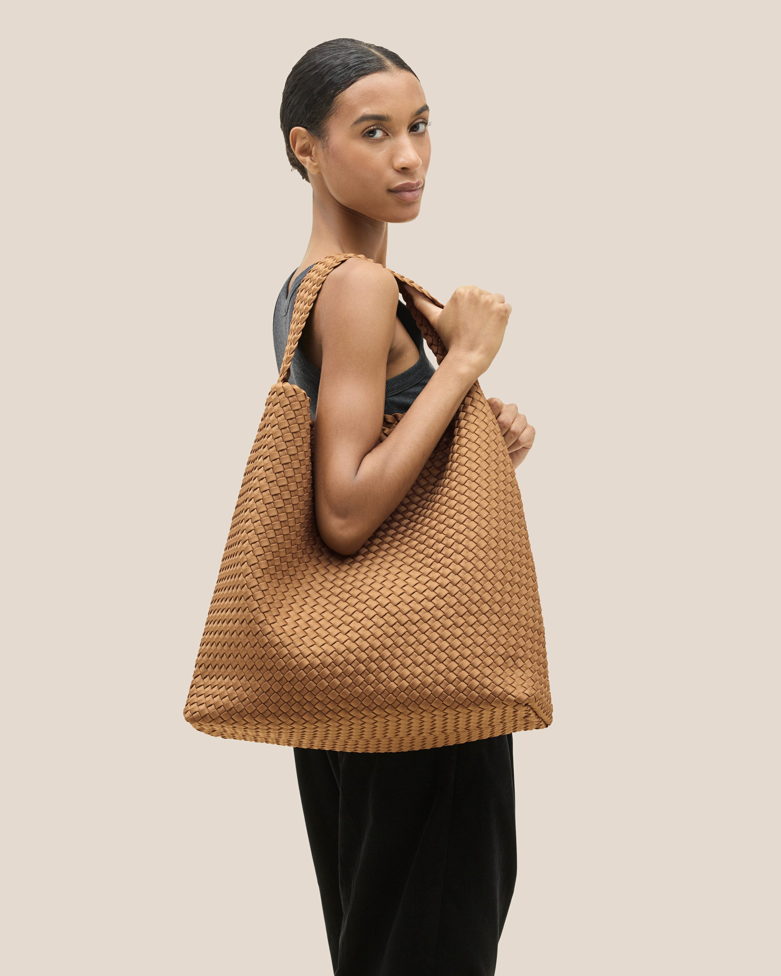 Nomad Hobo in Montauk shown on model to illustrate scale and soft silhouette.