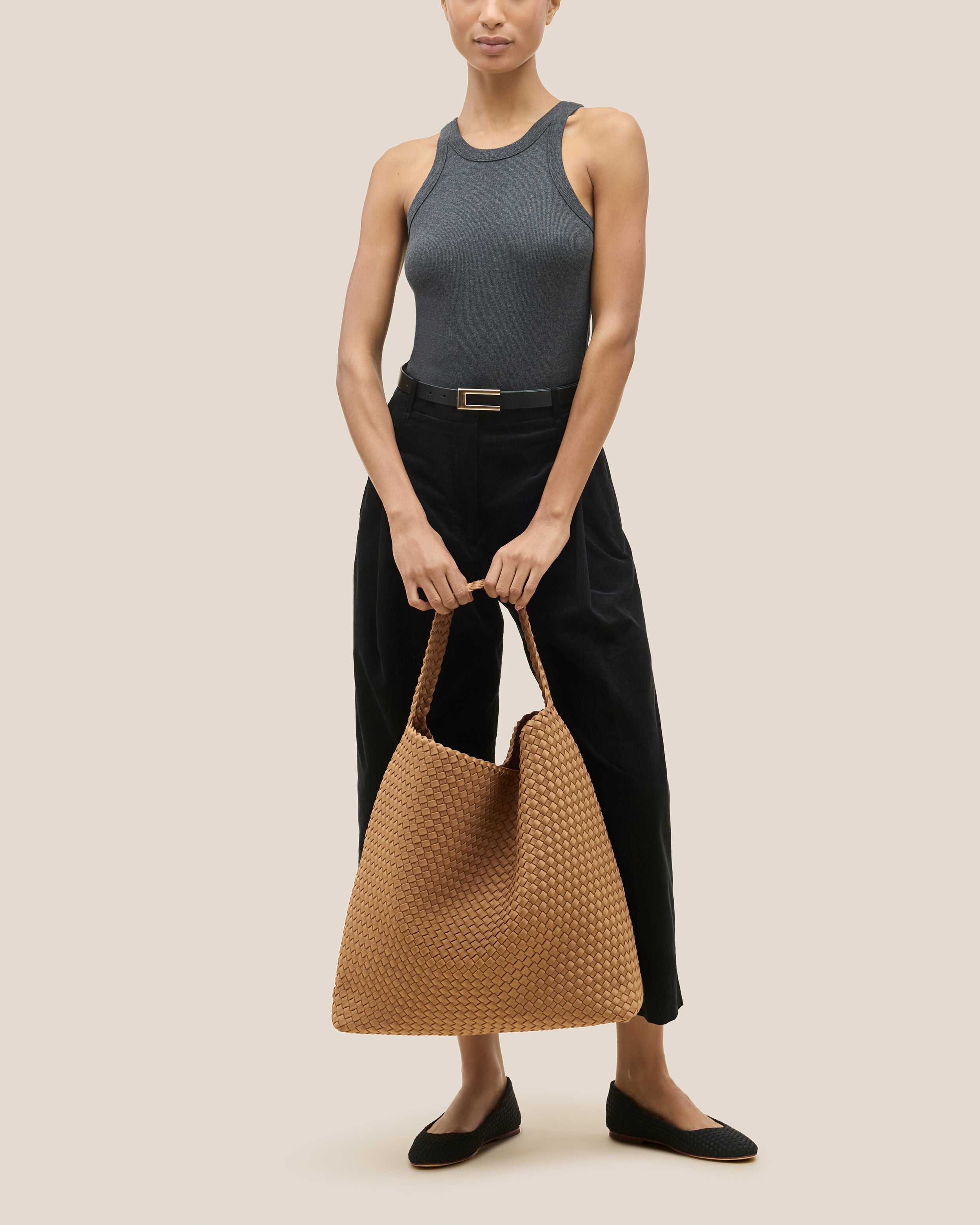 Nomad Hobo in Montauk shown on model to illustrate scale and soft silhouette.