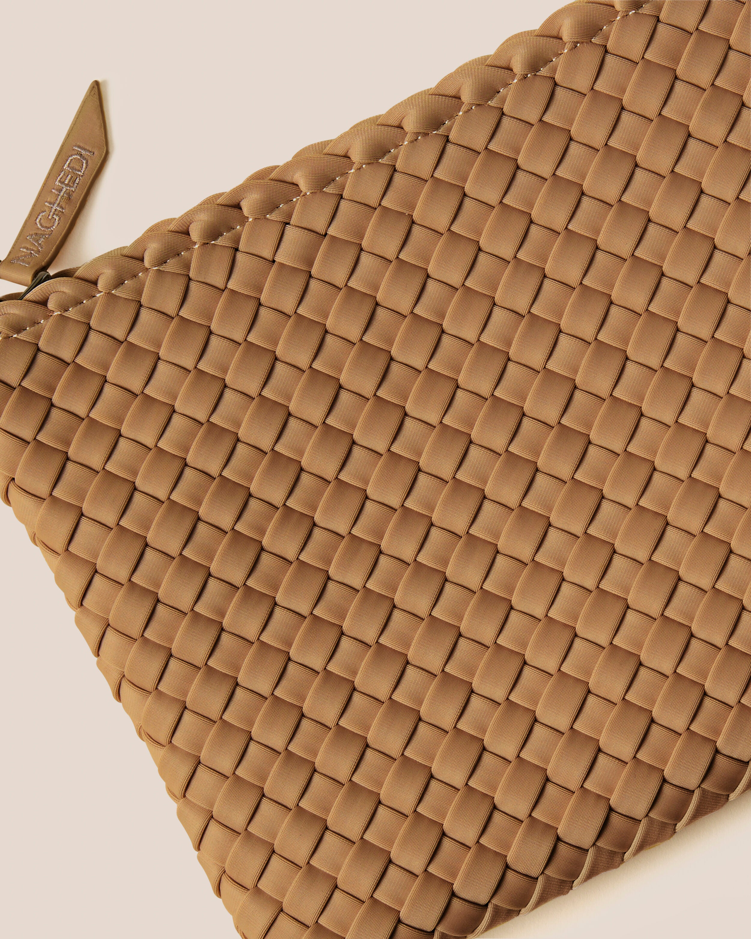 Close-up of included matching woven zippered pouch.
