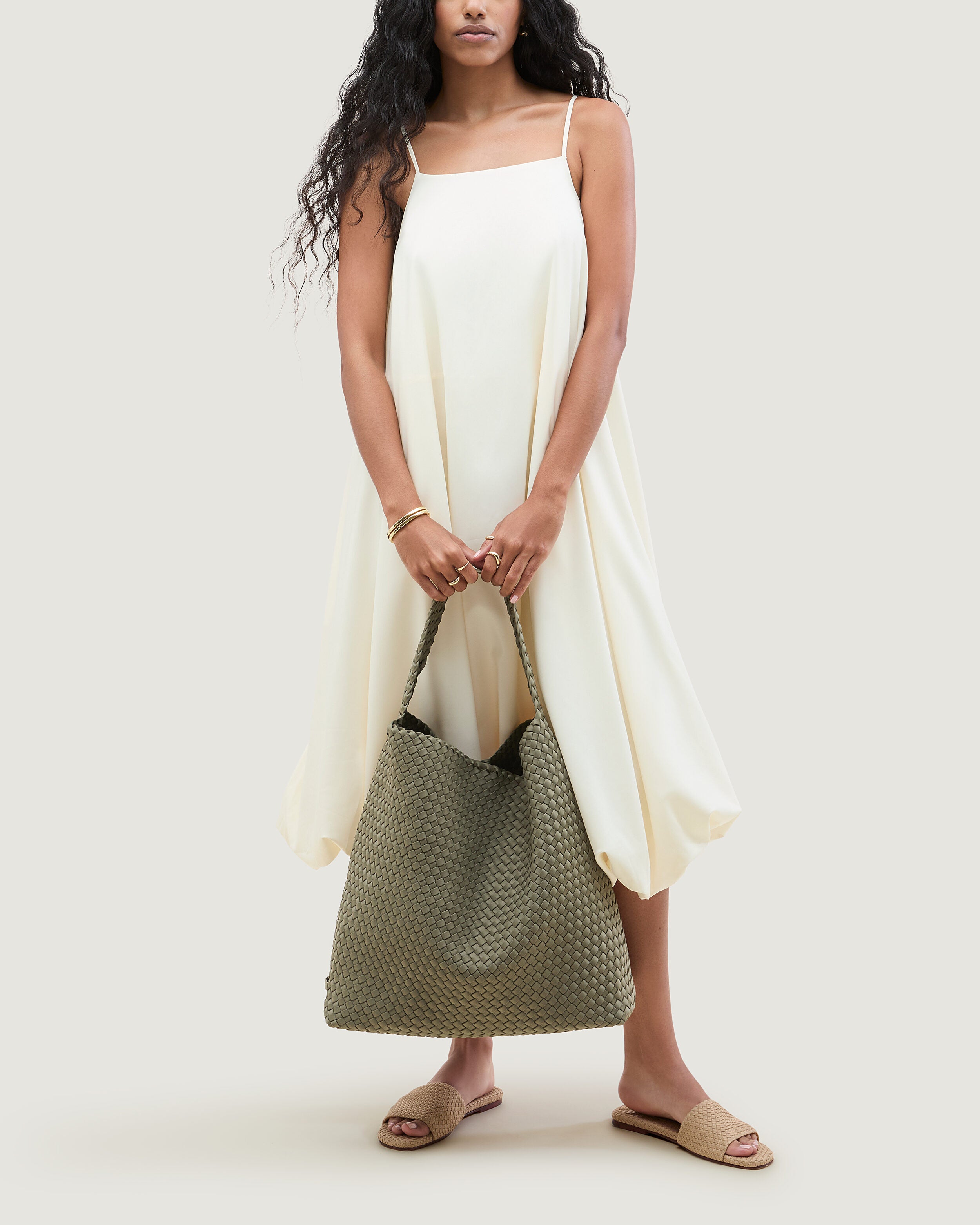 Nomad Hobo in Olea shown on model to illustrate scale and soft silhouette.