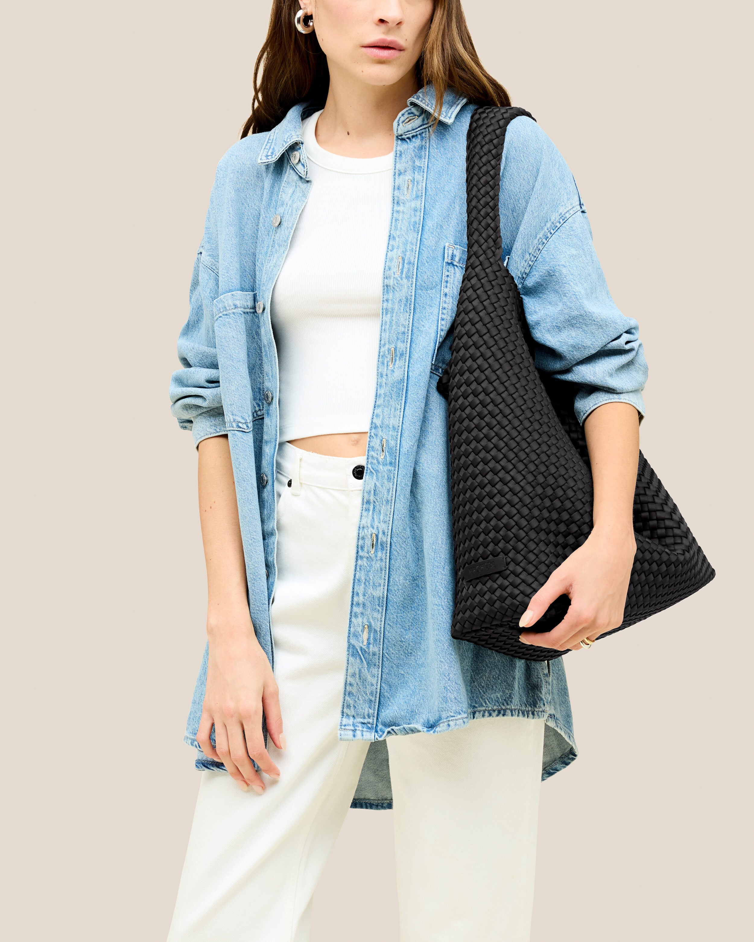 Nomad Hobo in Onyx shown on model to illustrate scale and soft silhouette.