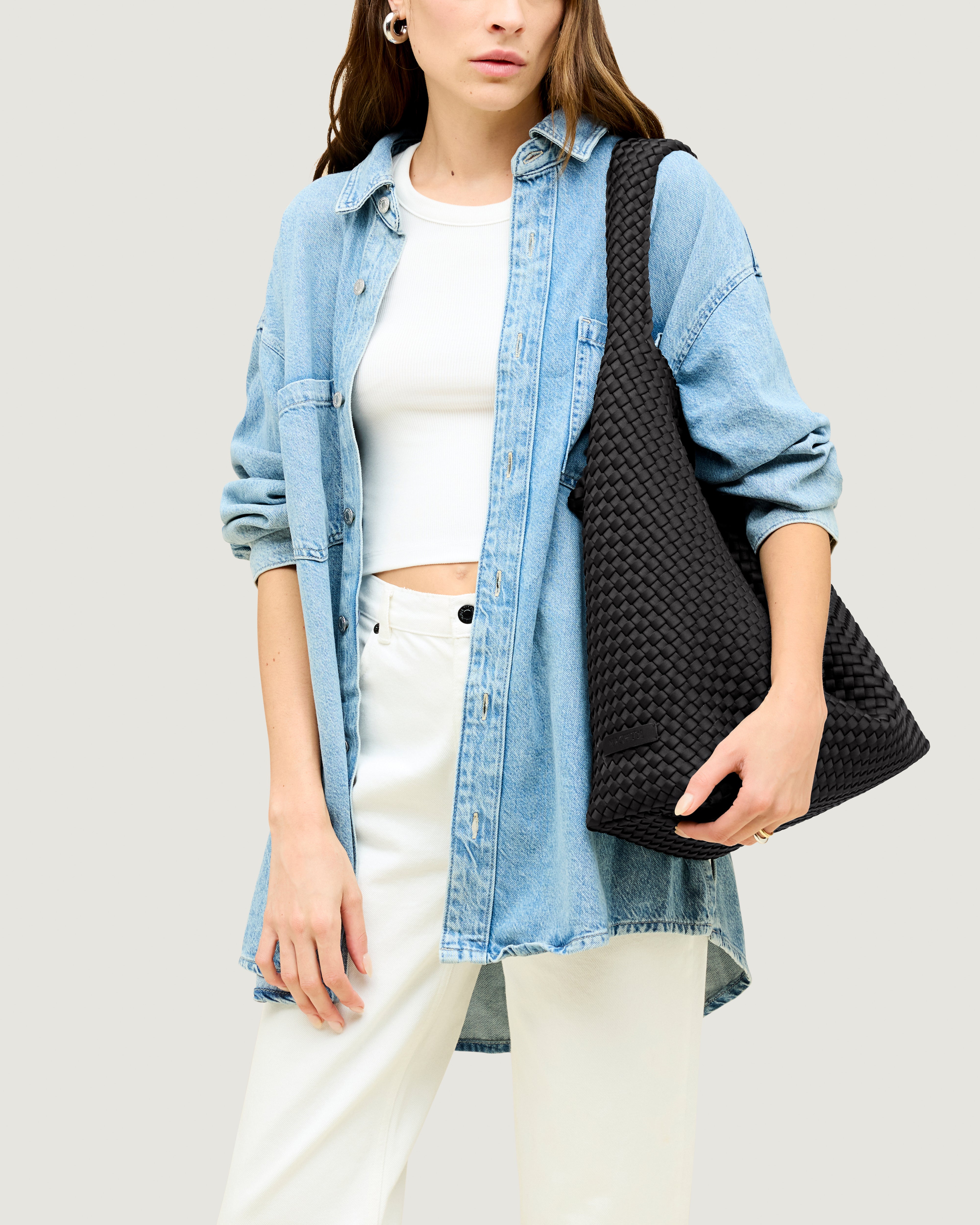 Nomad Hobo in Onyx shown on model to illustrate scale and soft silhouette.