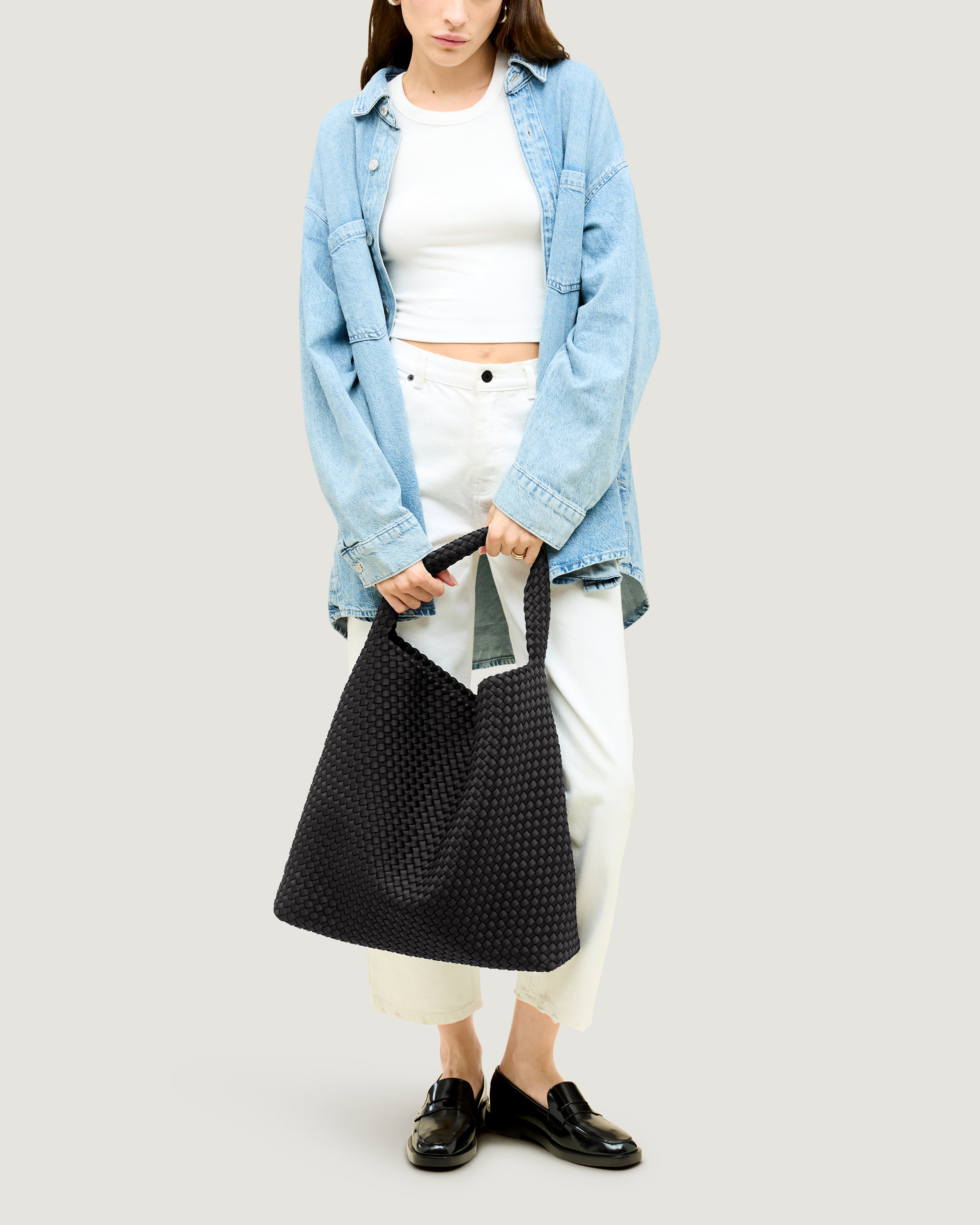 Nomad Hobo in Onyx shown on model to illustrate scale and soft silhouette.