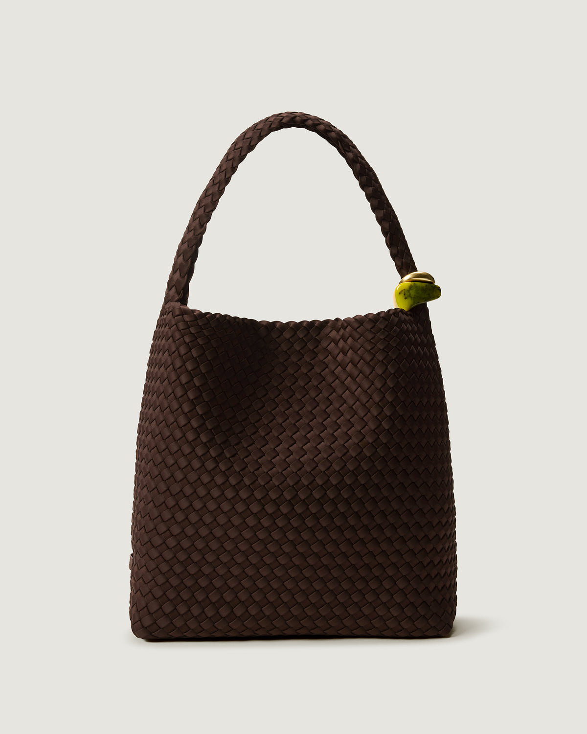 Nomad Hobo in Chocolate, a chocolate brown tone, in handwoven neoprene, featuring an open top with magnetic snap closure, sculptural bead ornaments, and handwoven shoulder strap.