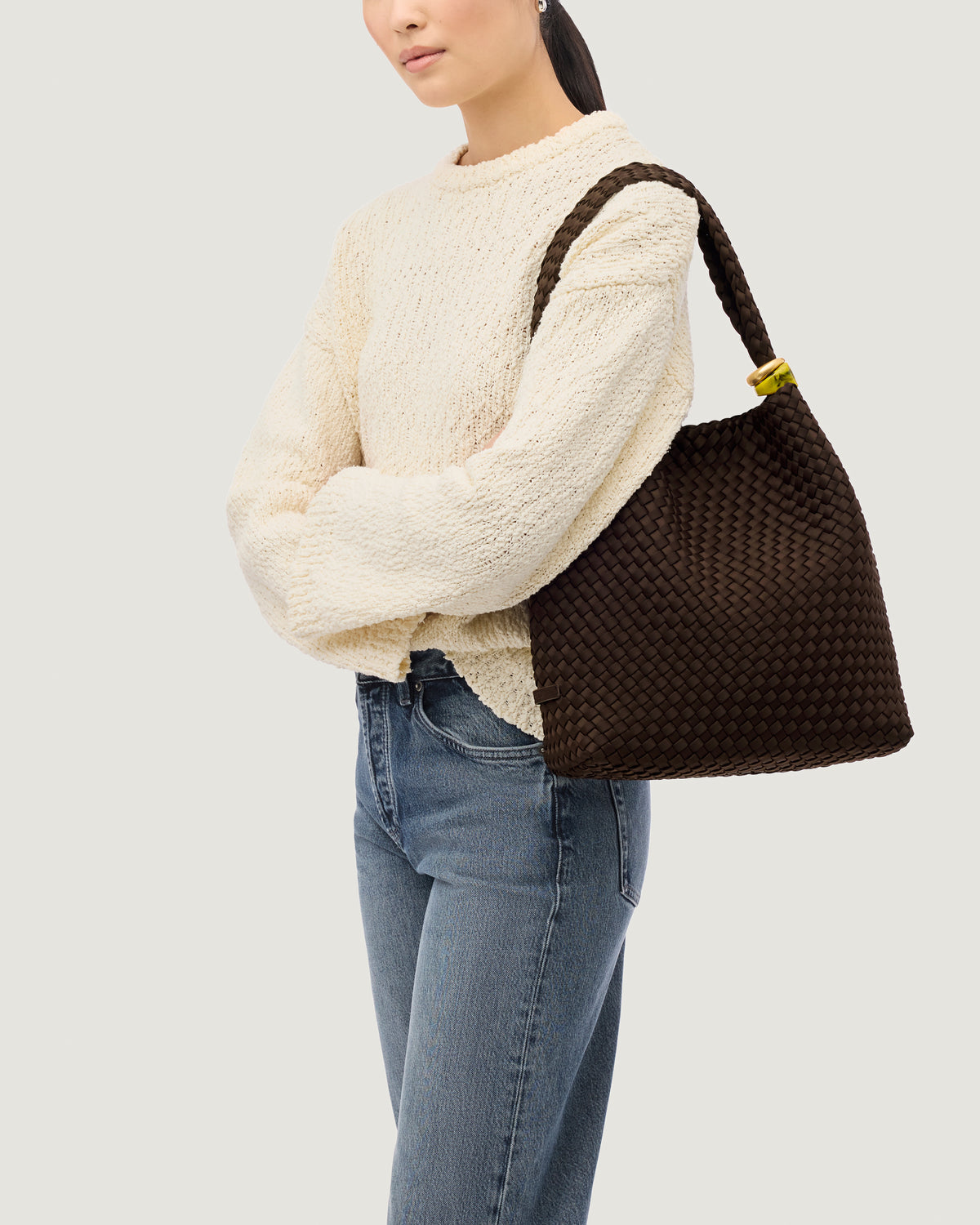 Nomad Hobo in Chocolate shown on model to illustrate scale and soft silhouette.