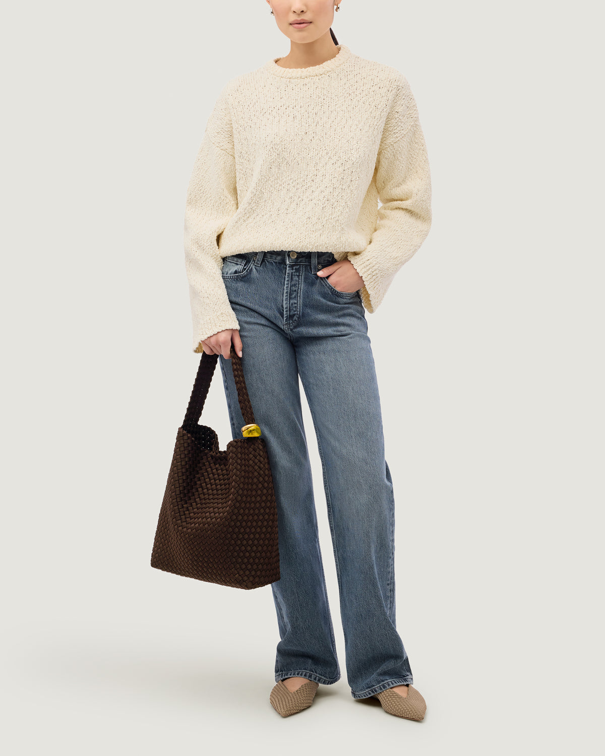 Nomad Hobo in Chocolate shown on model to illustrate scale and soft silhouette.
