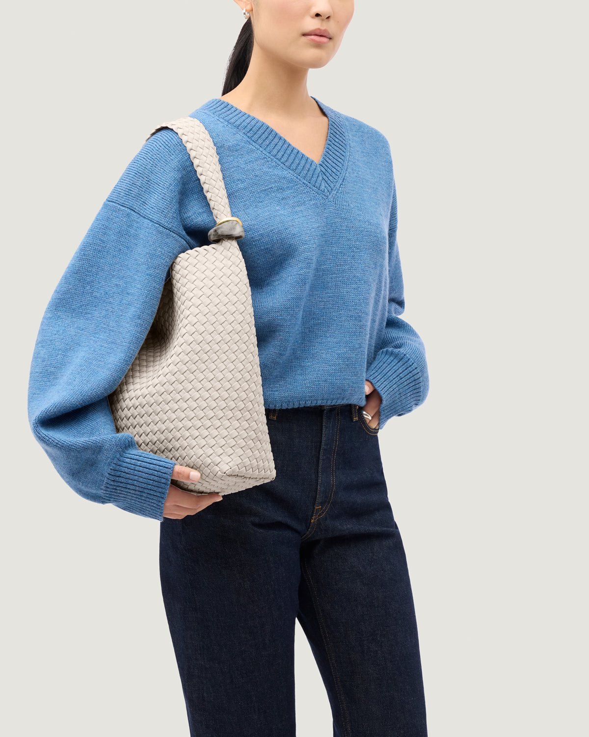 Nomad Hobo in Linen shown on model to illustrate scale and soft silhouette.