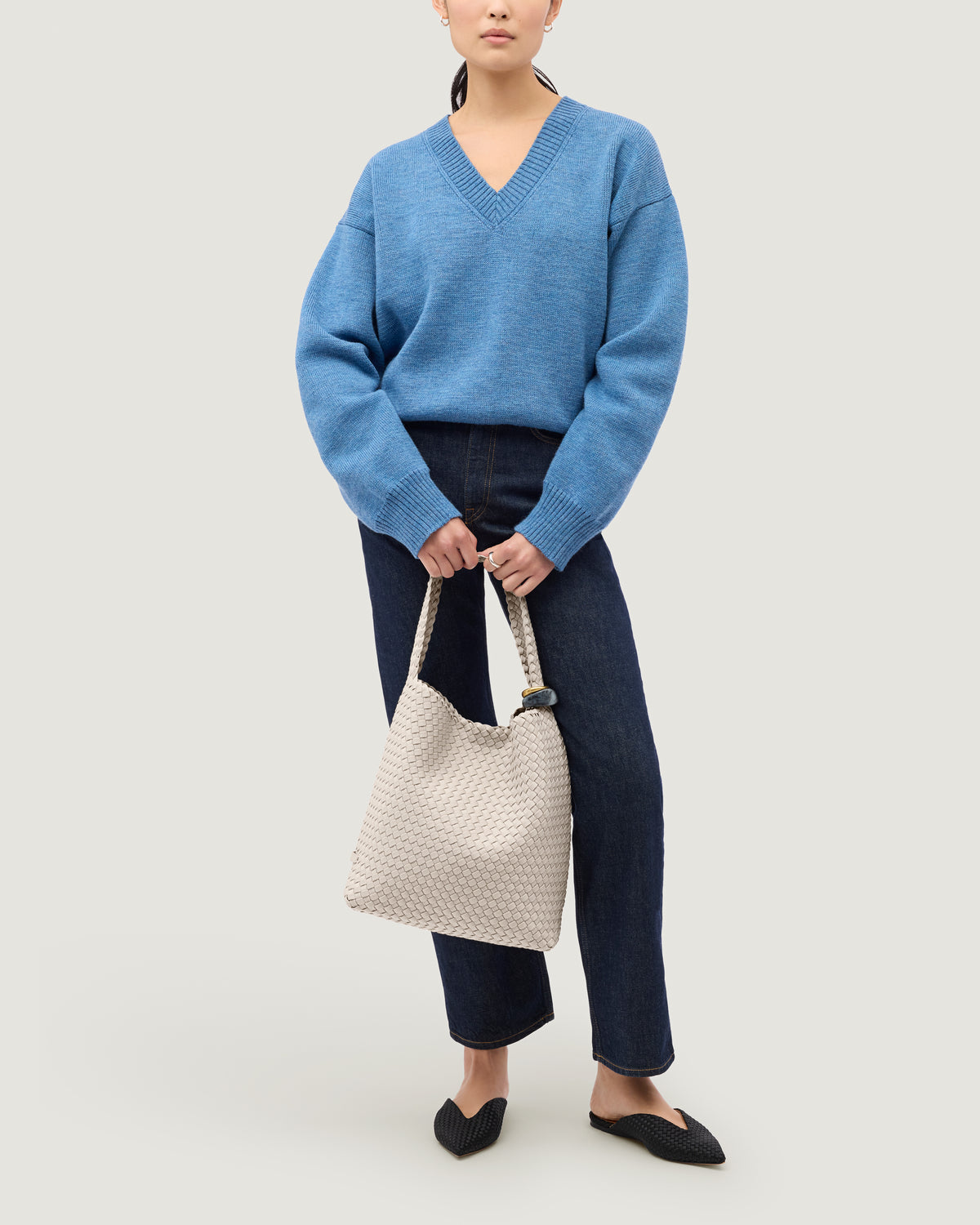 Nomad Hobo in Linen shown on model to illustrate scale and soft silhouette.