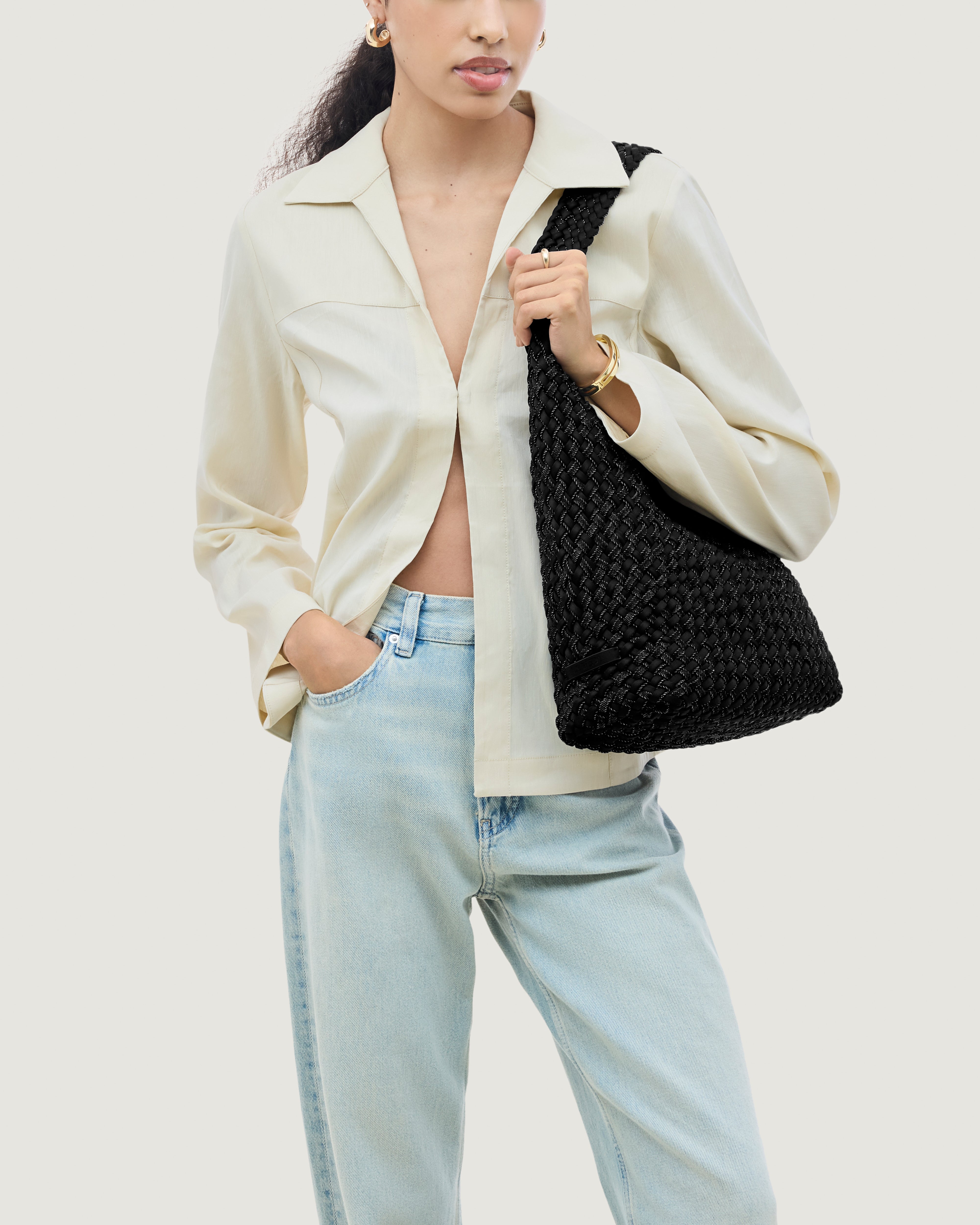 Nomad Hobo in Jet shown on model to illustrate scale and soft silhouette.
