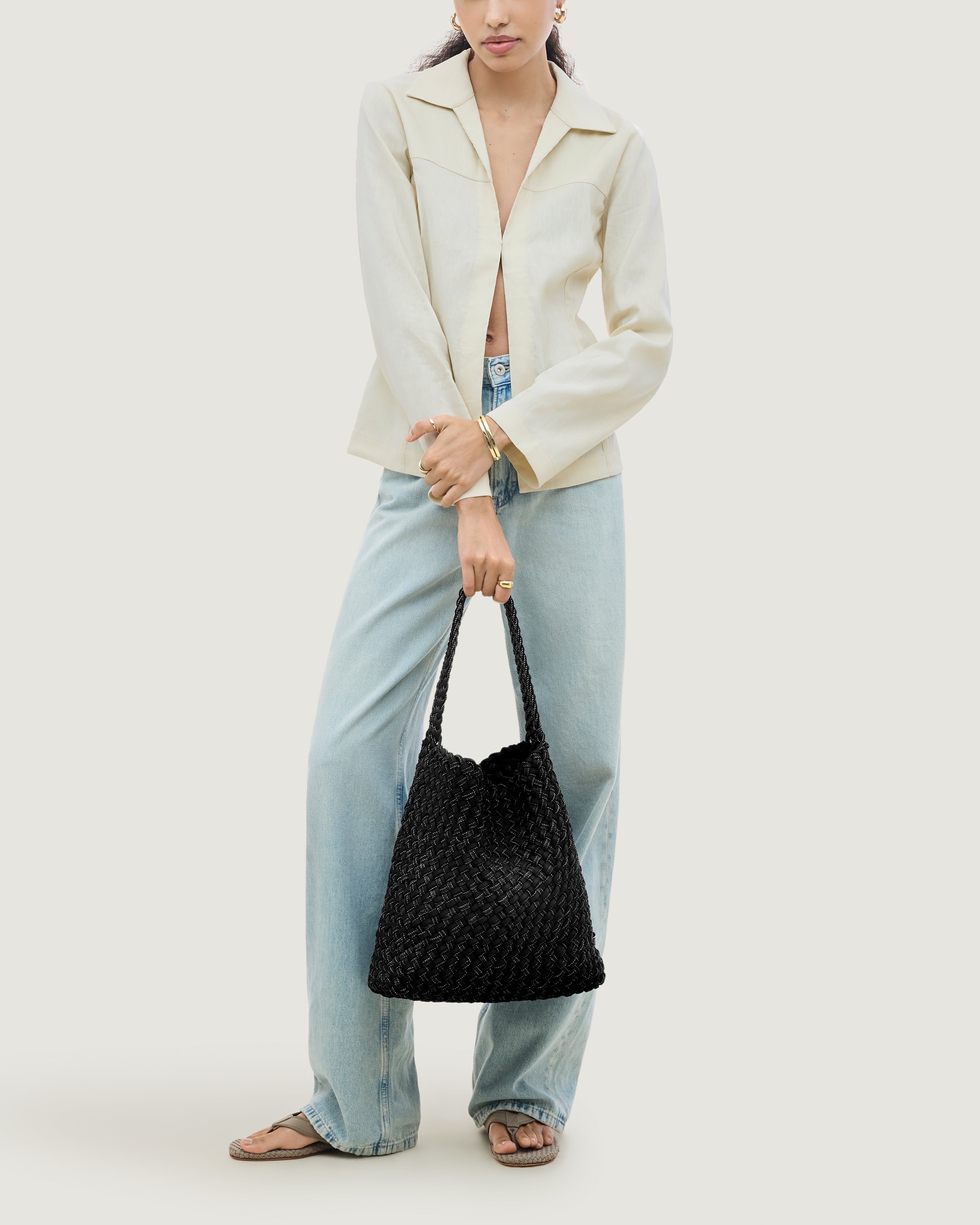 Nomad Hobo in Jet shown on model to illustrate scale and soft silhouette.