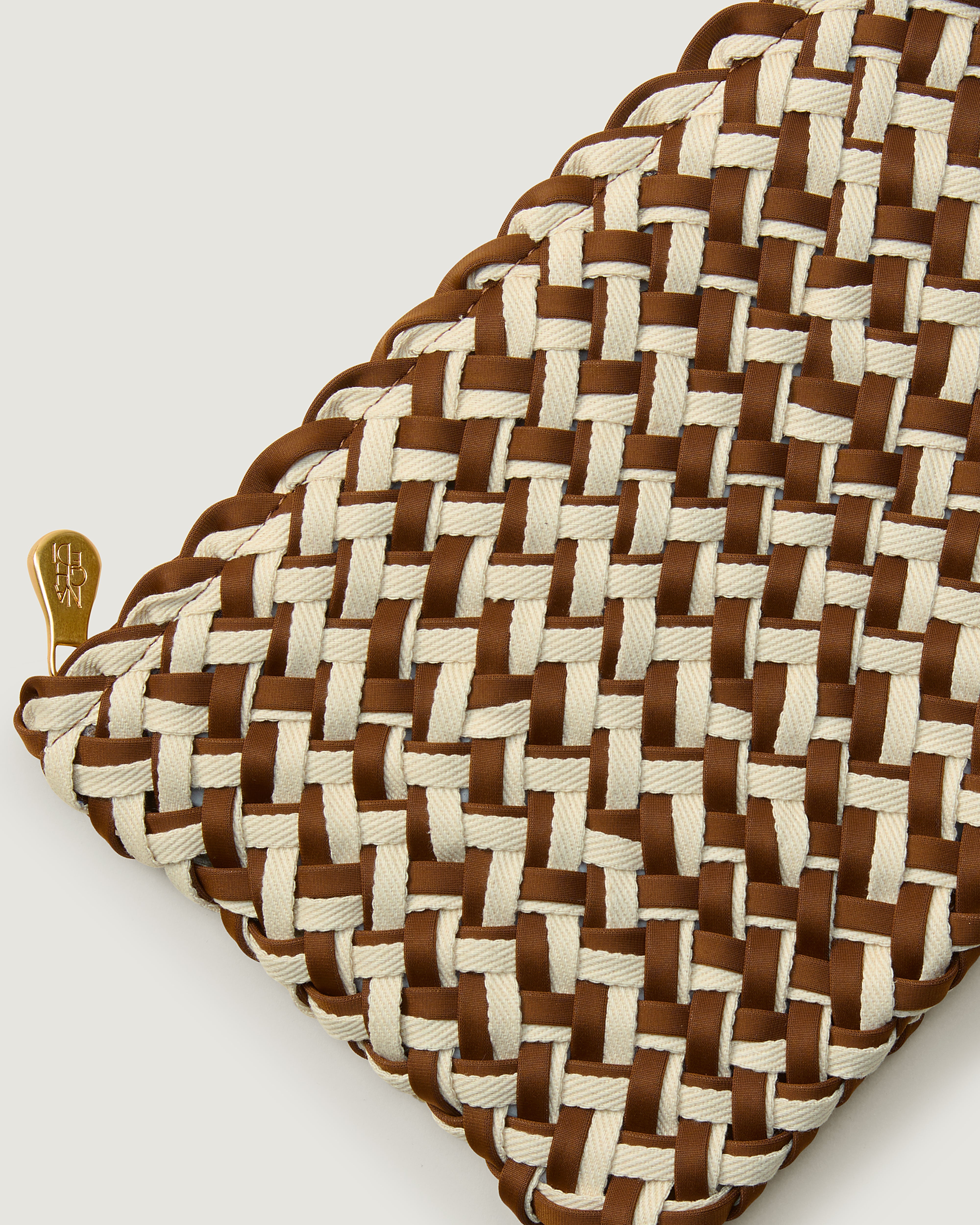 Close-up of included matching woven zippered pouch.