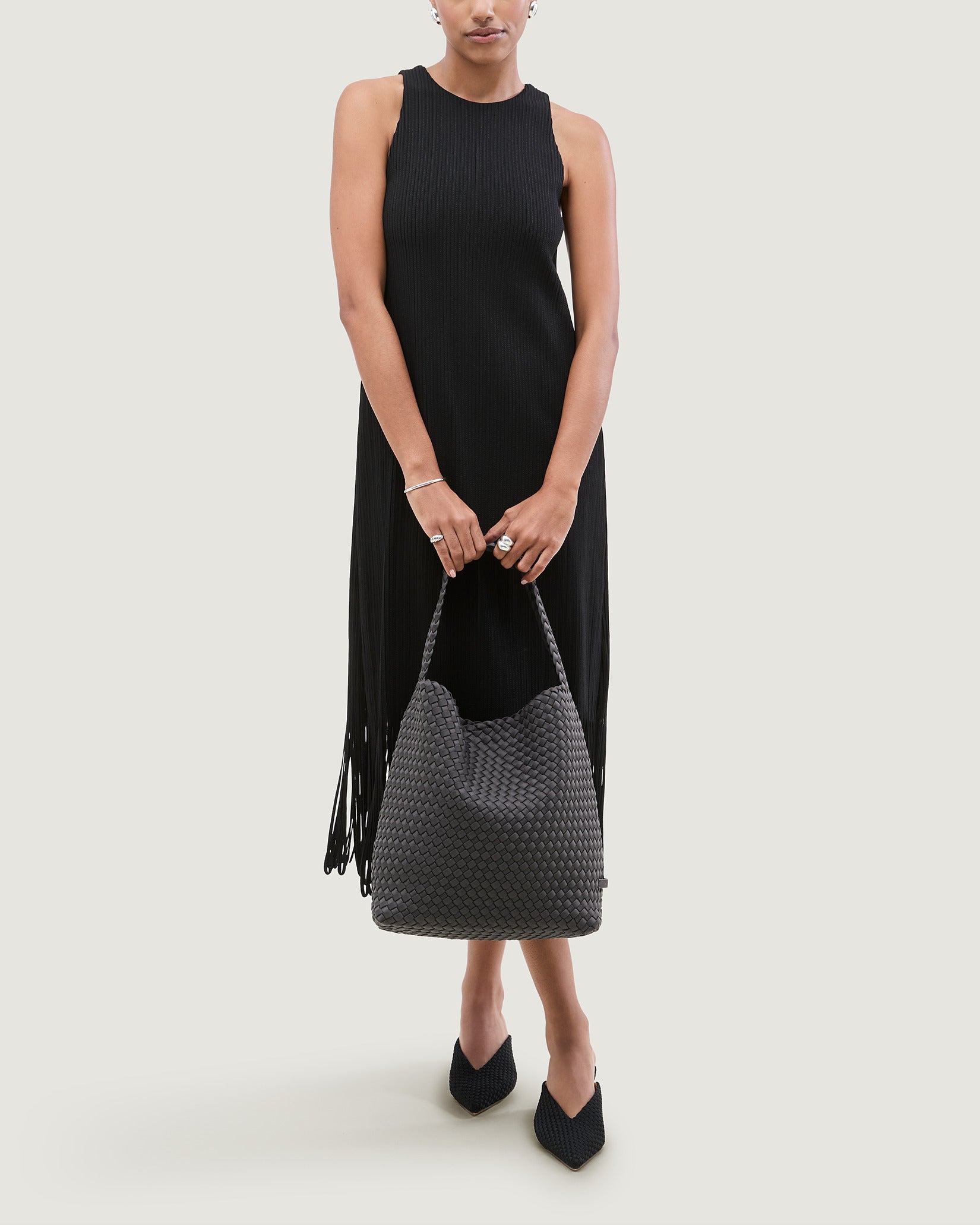 Nomad Medium Hobo Bag in Ash shown on model to illustrate scale and soft silhouette.