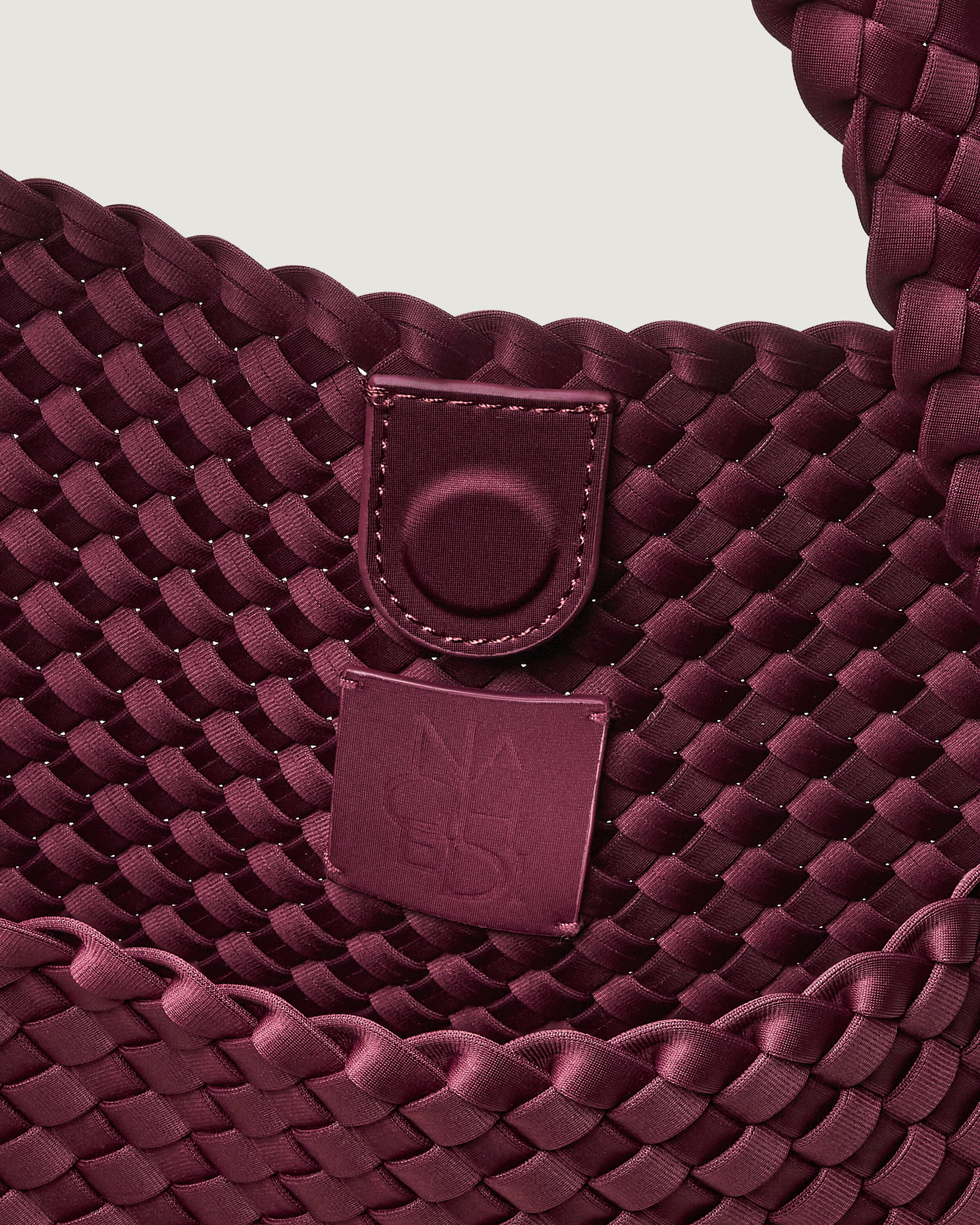 Interior close-up of Nomad Hobo in Bordeaux showing its open top with magnetic snap closure, and unlined interior.