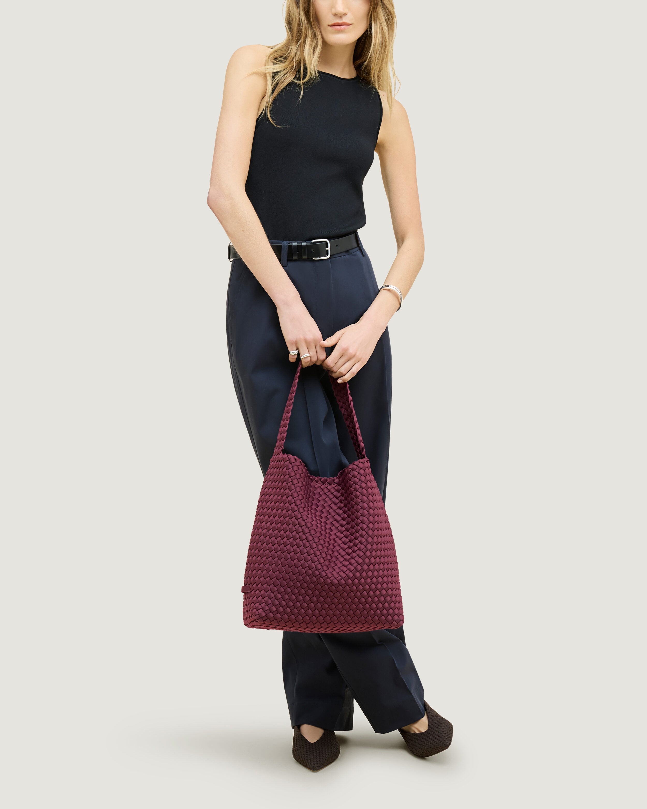 Nomad Hobo in Bordeaux shown on model to illustrate scale and soft silhouette.