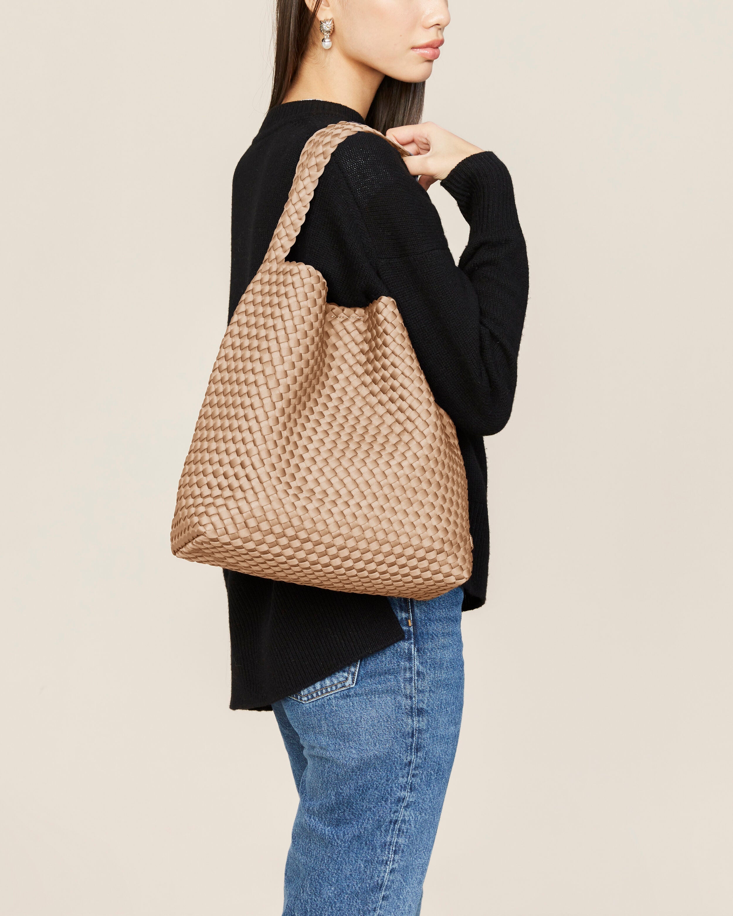 Nomad Hobo in Camel shown on model to illustrate scale and soft silhouette.