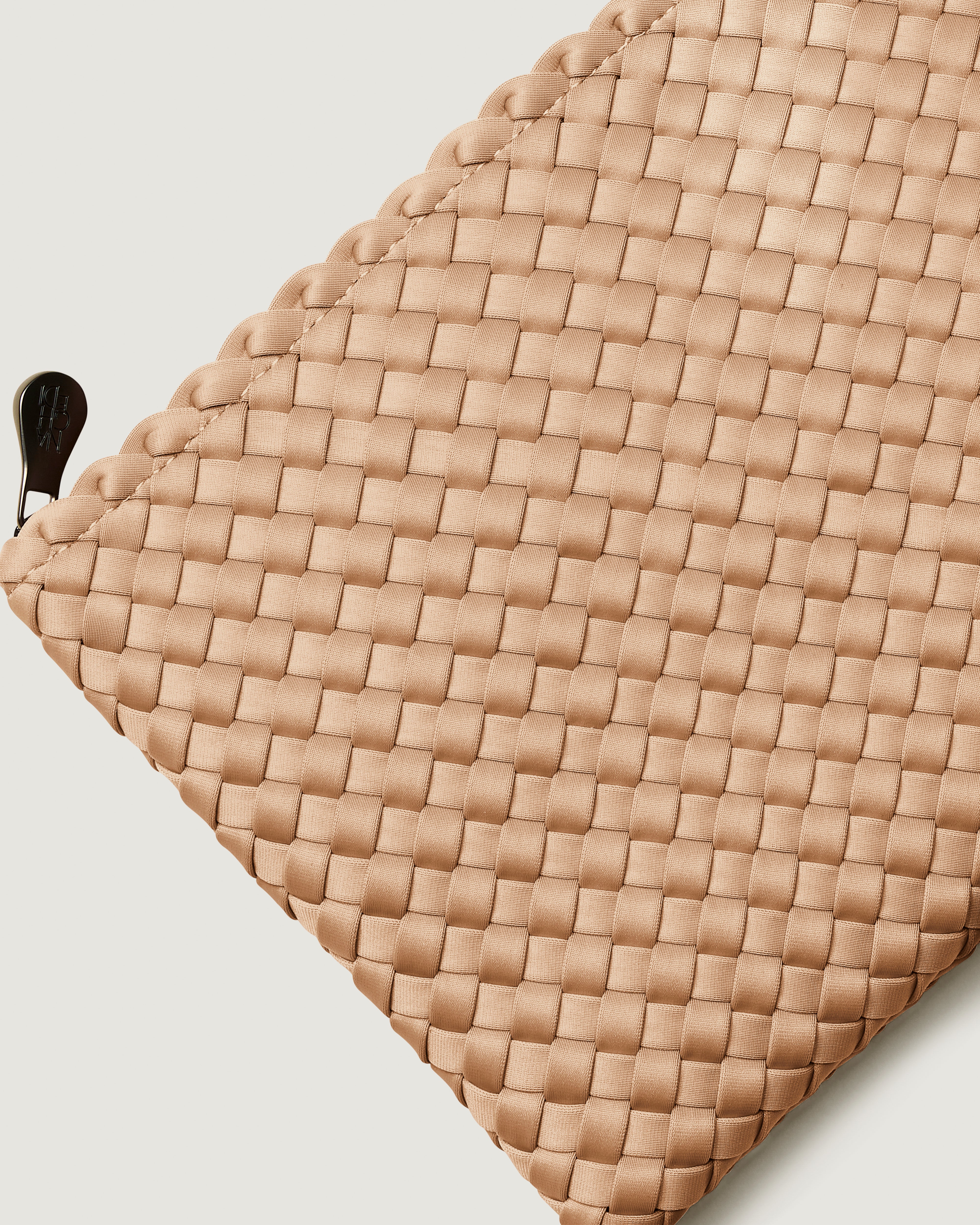 Close-up of included matching woven zippered pouch.