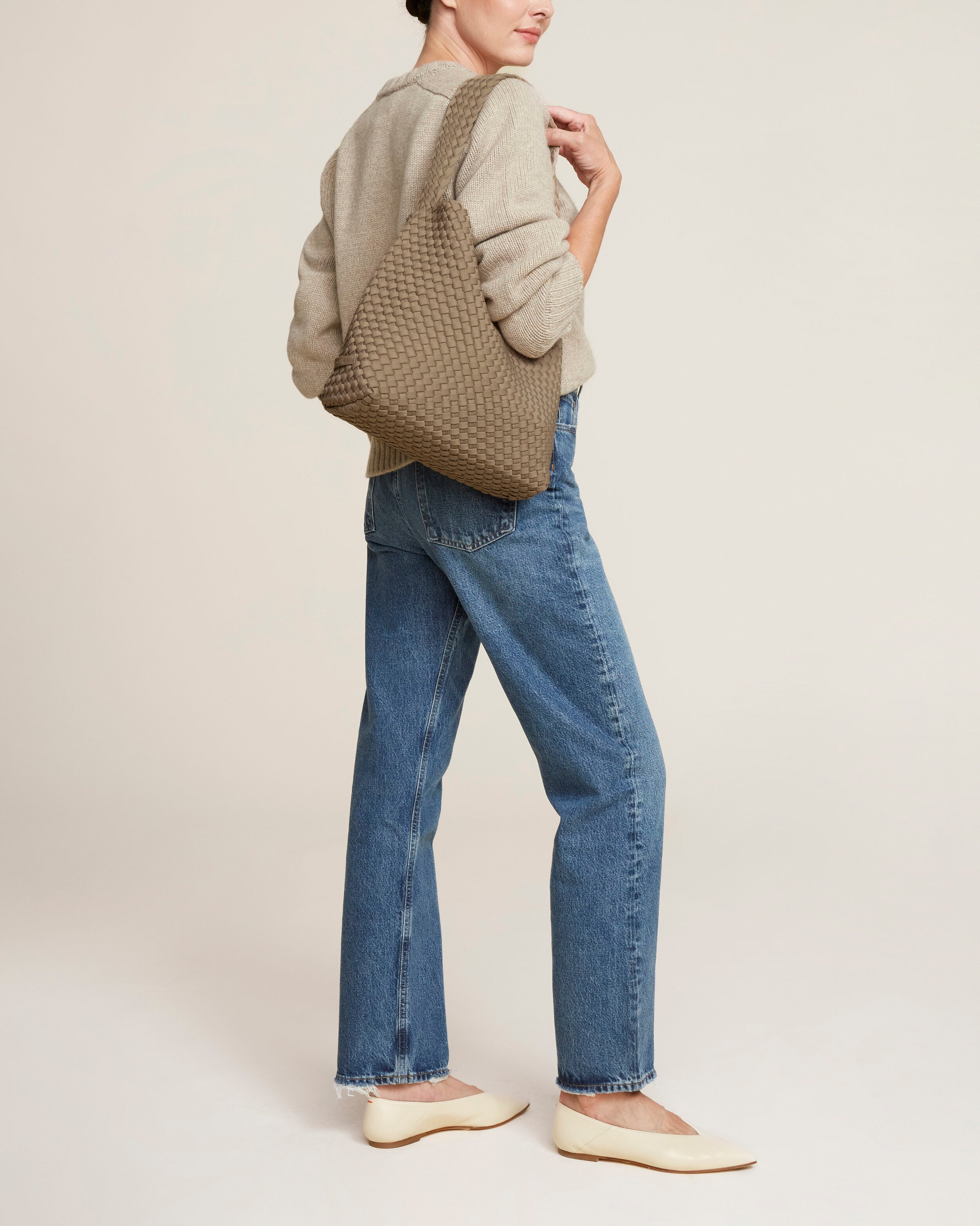 Nomad Hobo in Cashmere shown on model to illustrate scale and soft silhouette.