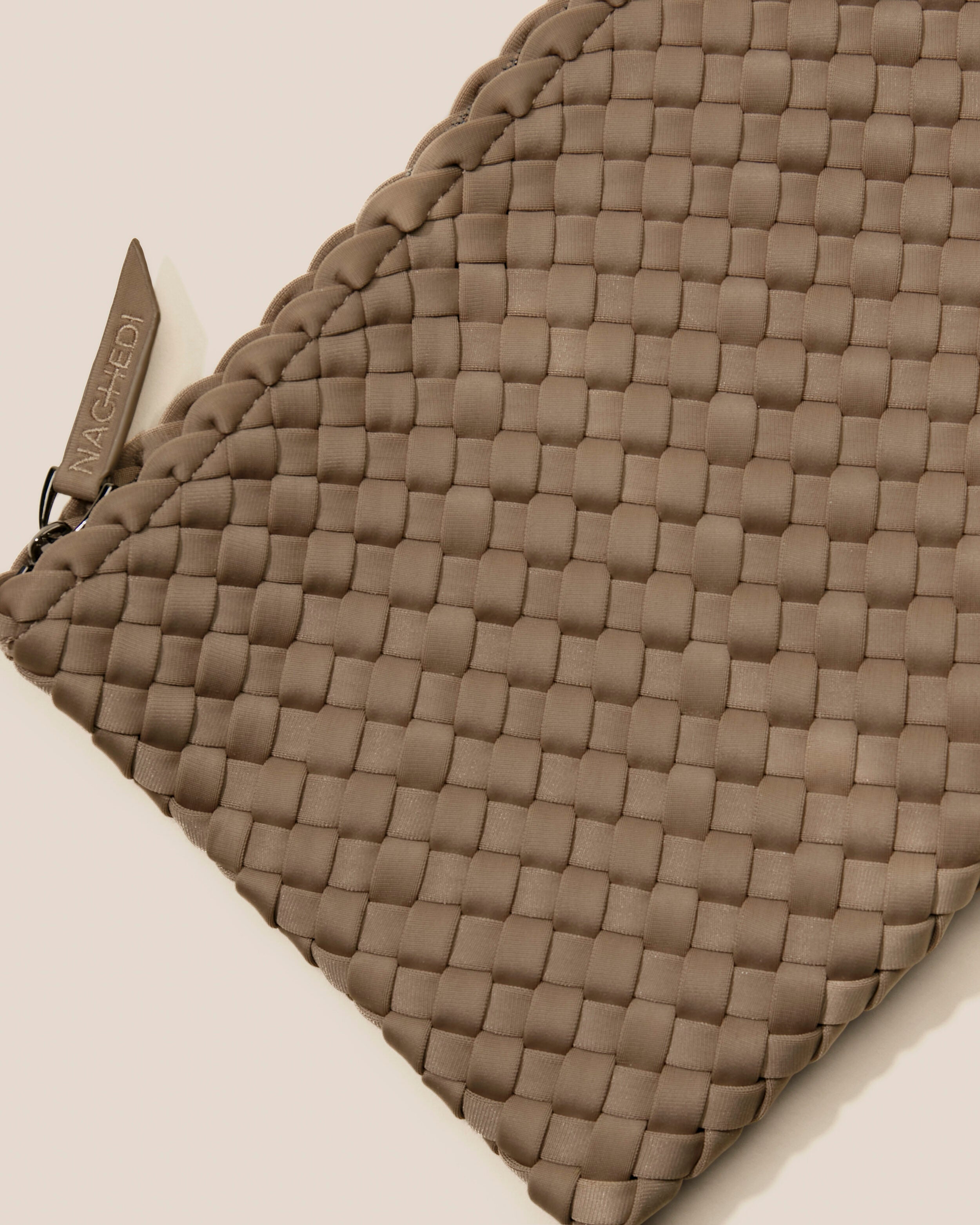 Close-up of included matching woven zippered pouch.