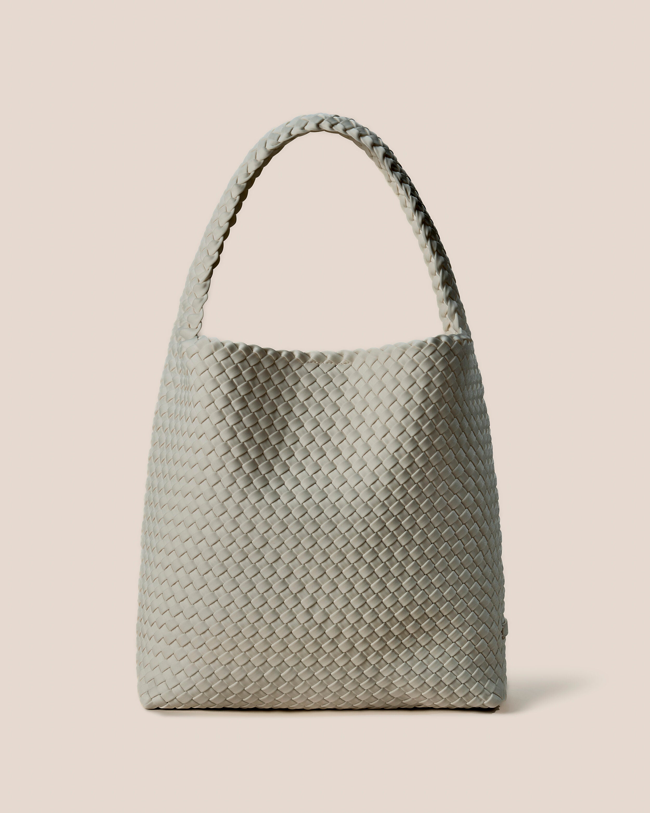 Nomad Hobo in Celadon, a light jade green tone, in handwoven neoprene, featuring an open top with magnetic snap closure, and handwoven shoulder strap lays comfortably flat.