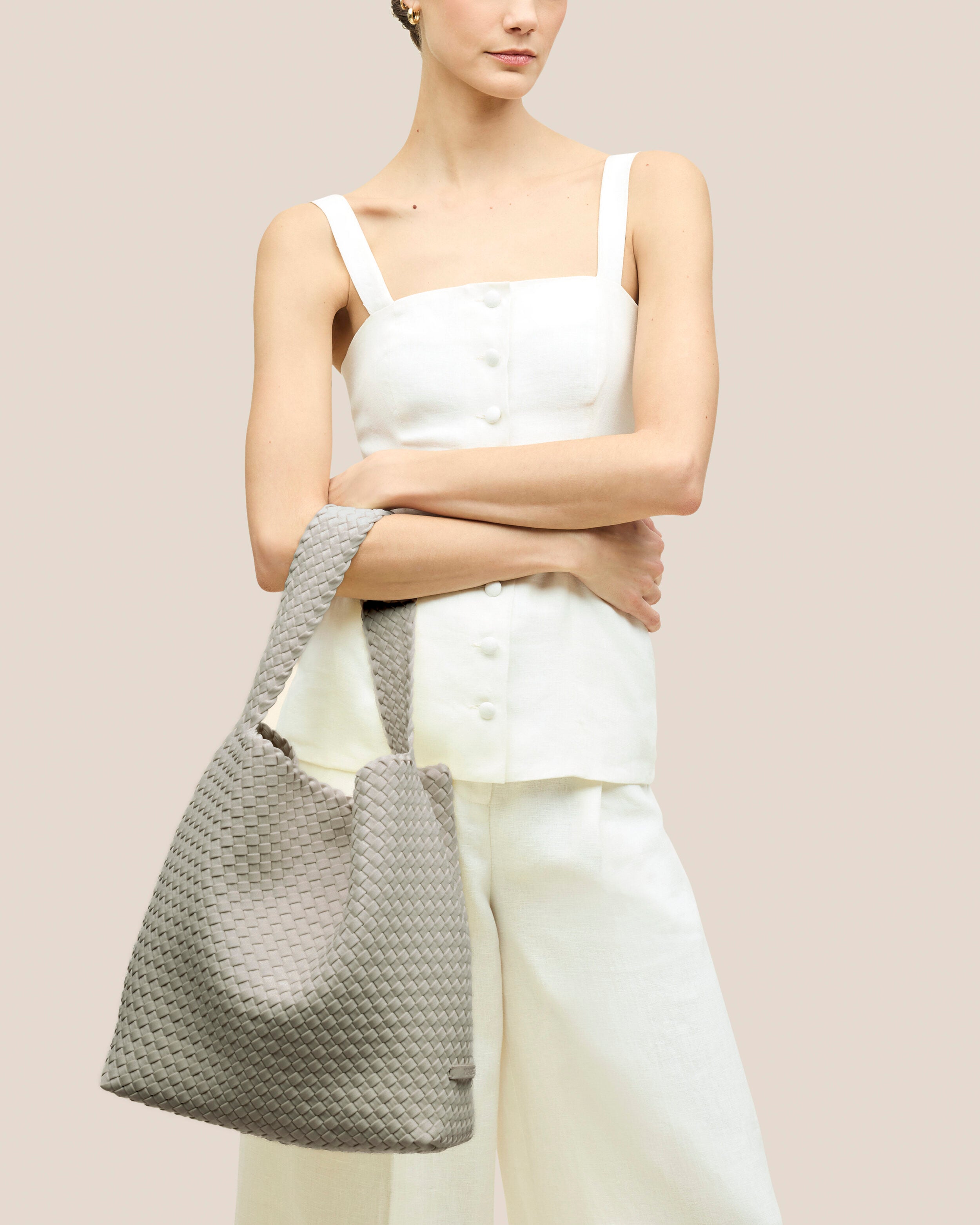 Nomad Hobo in Celadon shown on model to illustrate scale and soft silhouette.