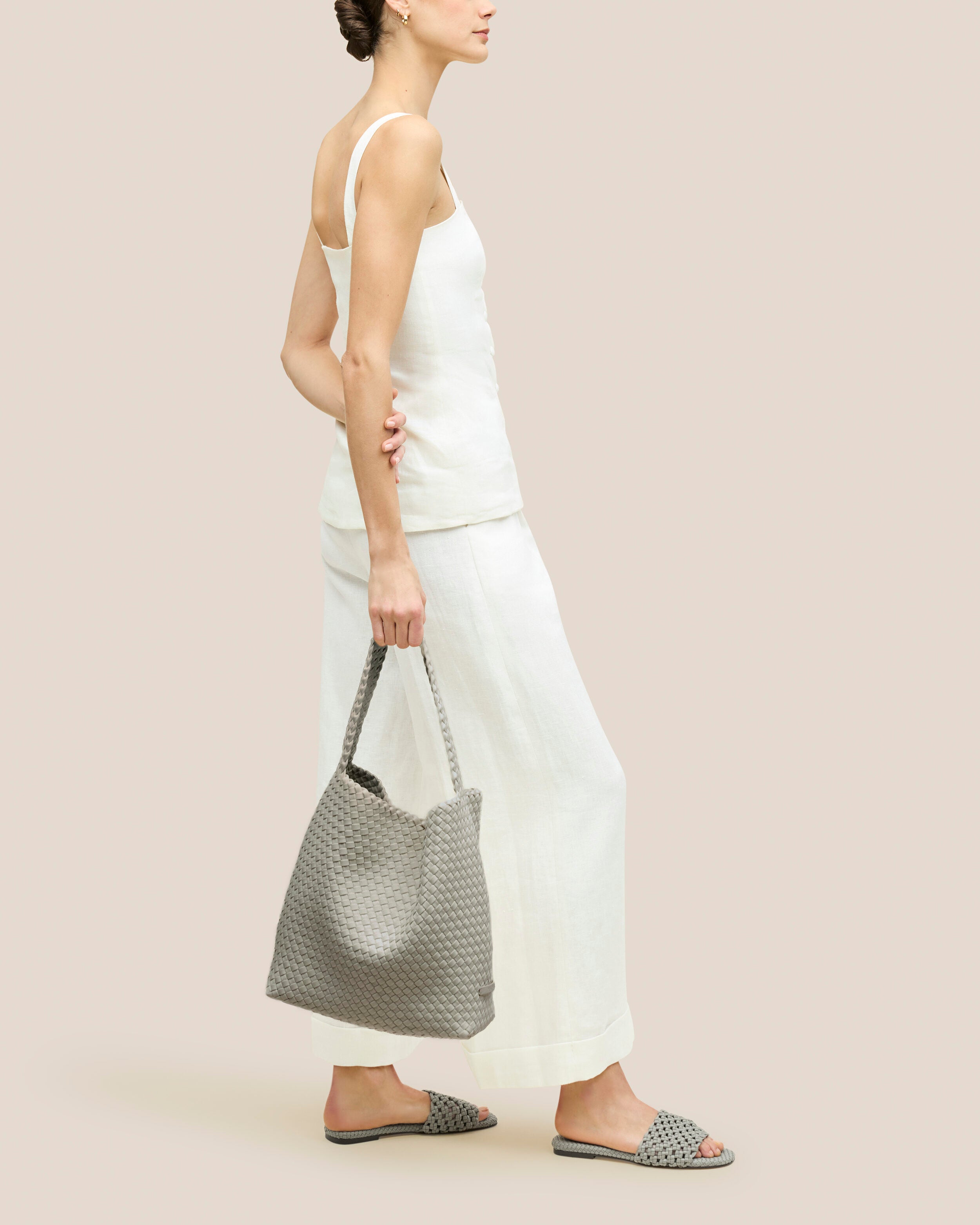 Nomad Hobo in Celadon shown on model to illustrate scale and soft silhouette.