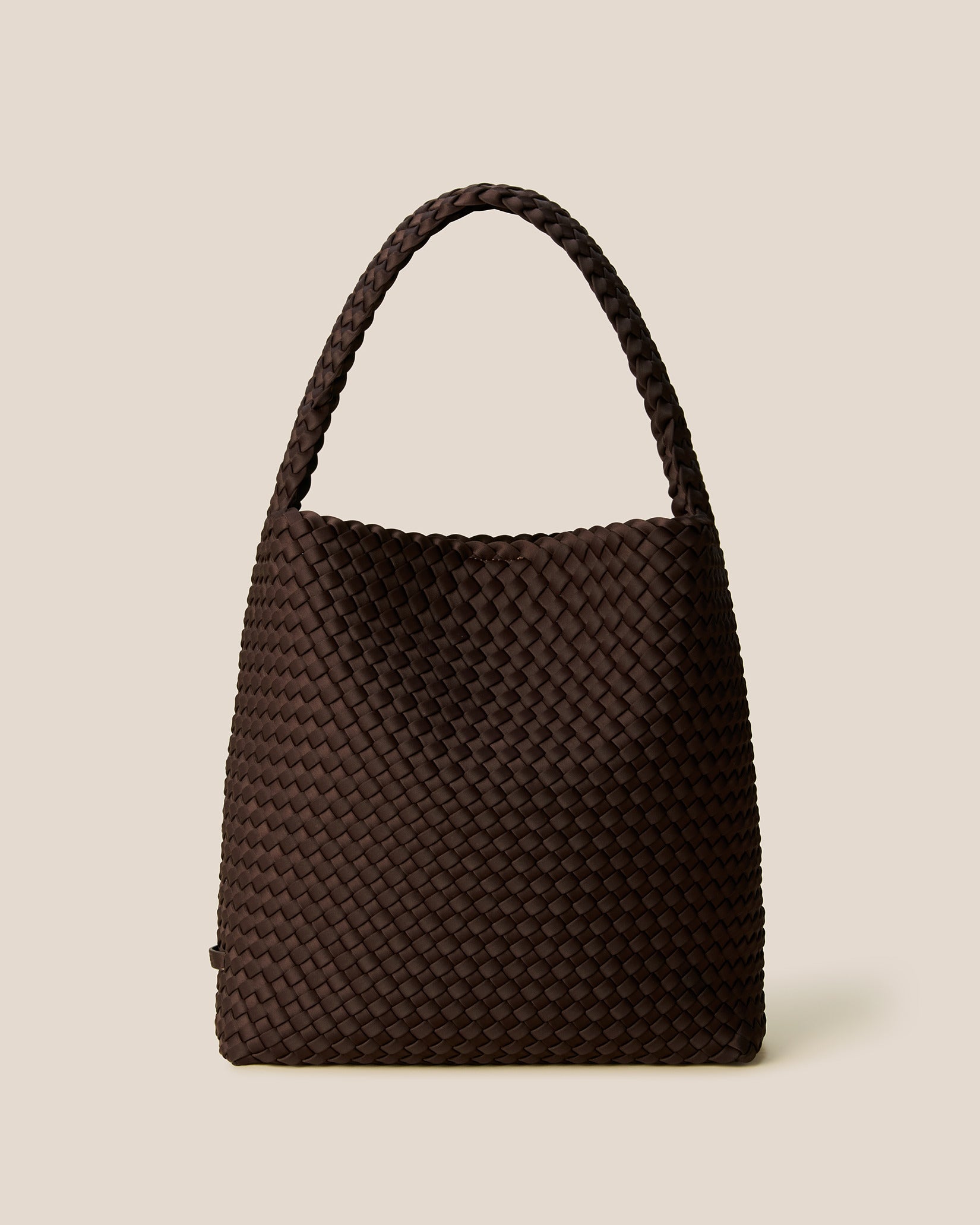 Nomad Medium Hobo Bag in Chocolate, a dark chocolate brown tone, in handwoven neoprene featuring an open top with magnetic snap closure, and handwoven shoulder strap lays comfortably flat.