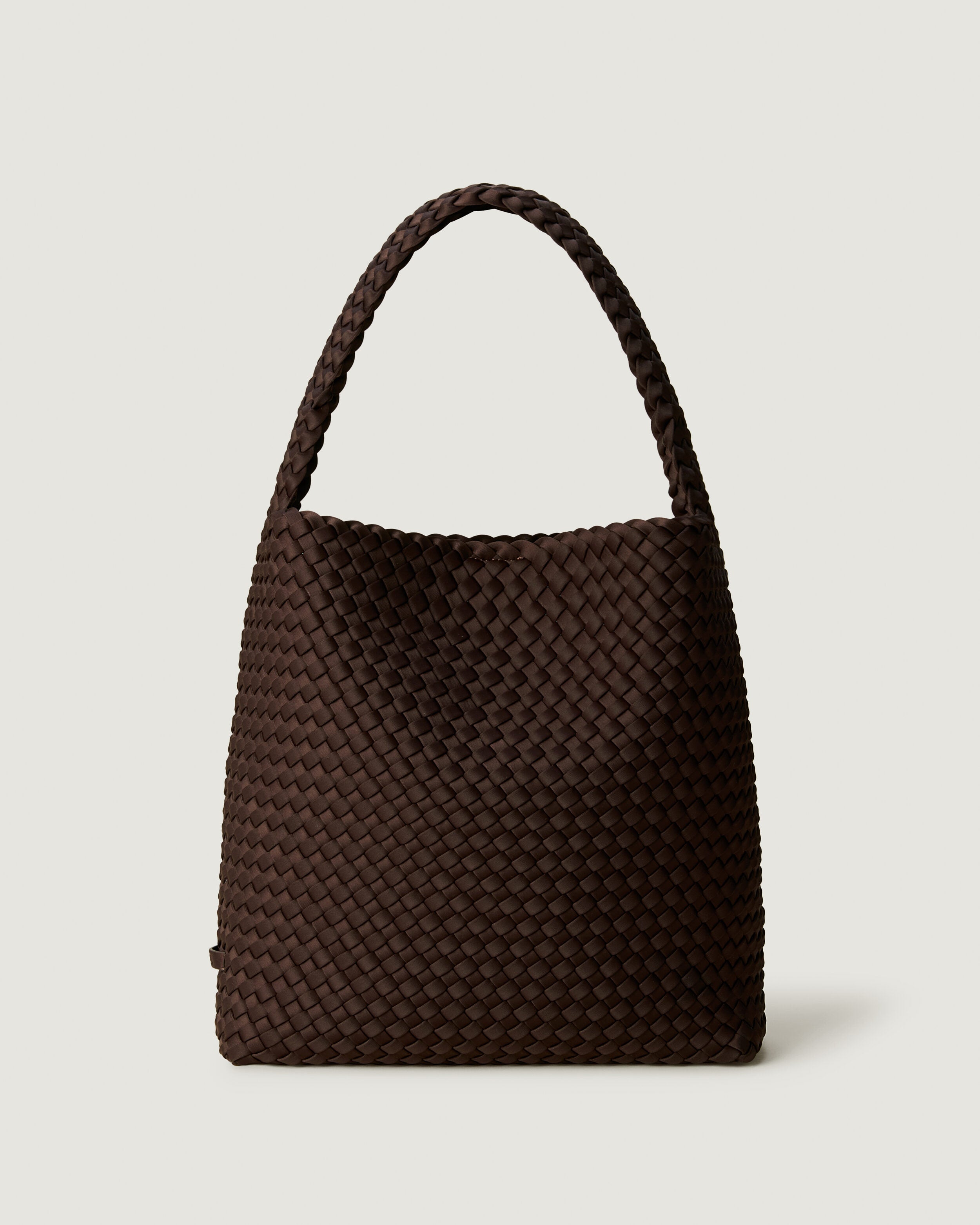 Nomad Hobo in Chocolate, a dark chocolate brown tone, in handwoven neoprene, featuring an open top with magnetic snap closure, and handwoven shoulder strap lays comfortably flat.