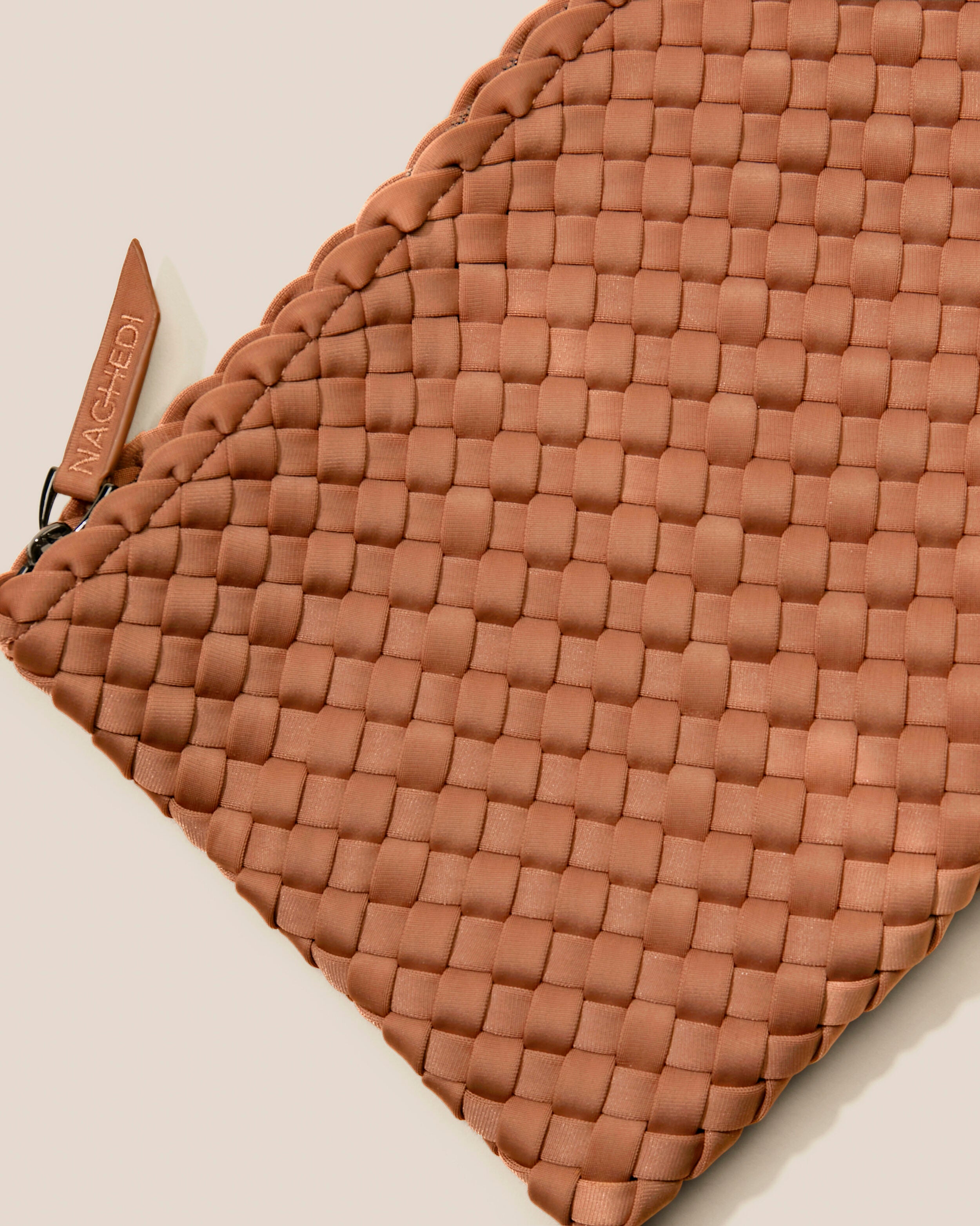 Close-up of included matching woven zippered pouch.