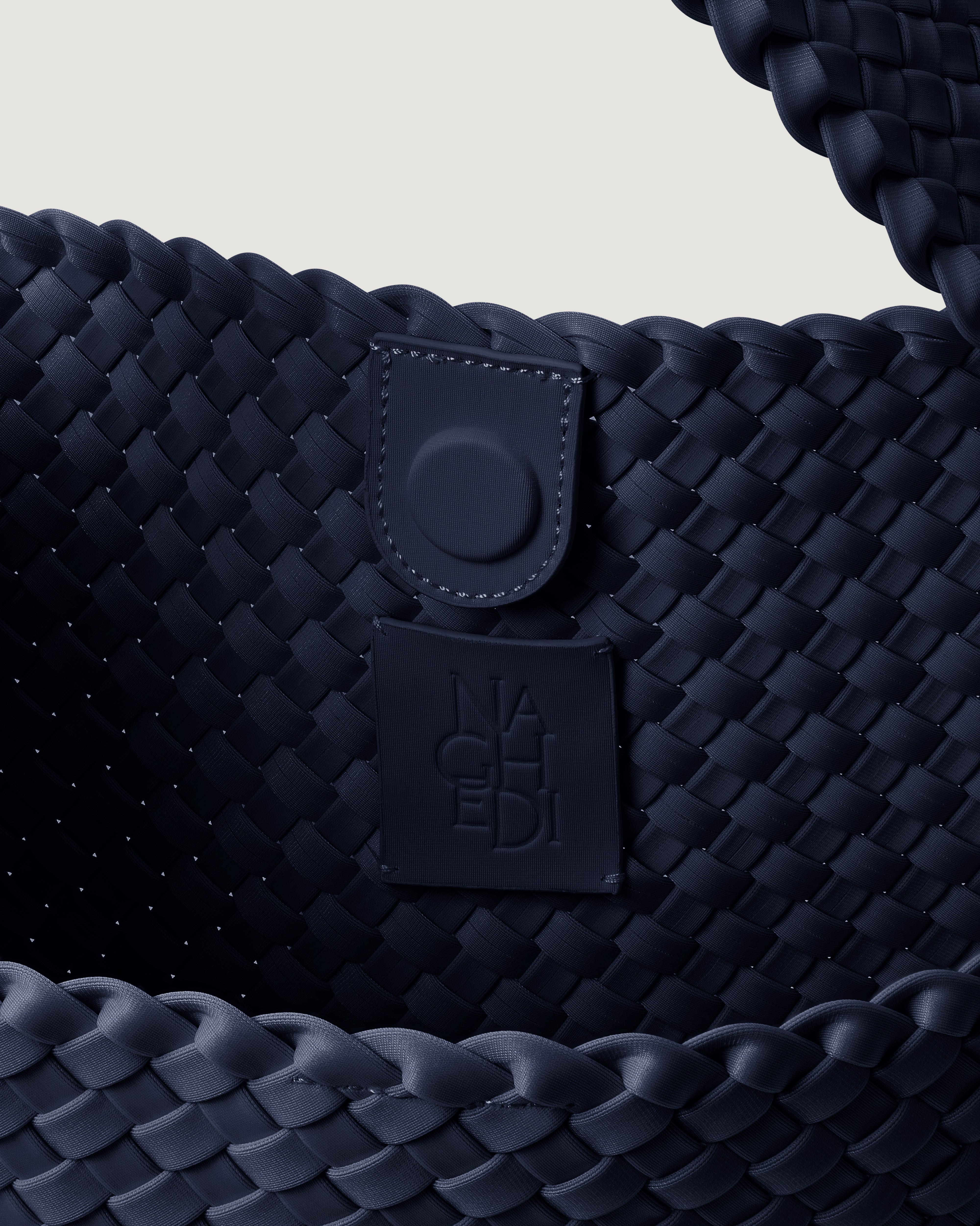 Interior close-up of Nomad Hobo in Ink Blue showing its open top with magnetic snap closure, and unlined interior.