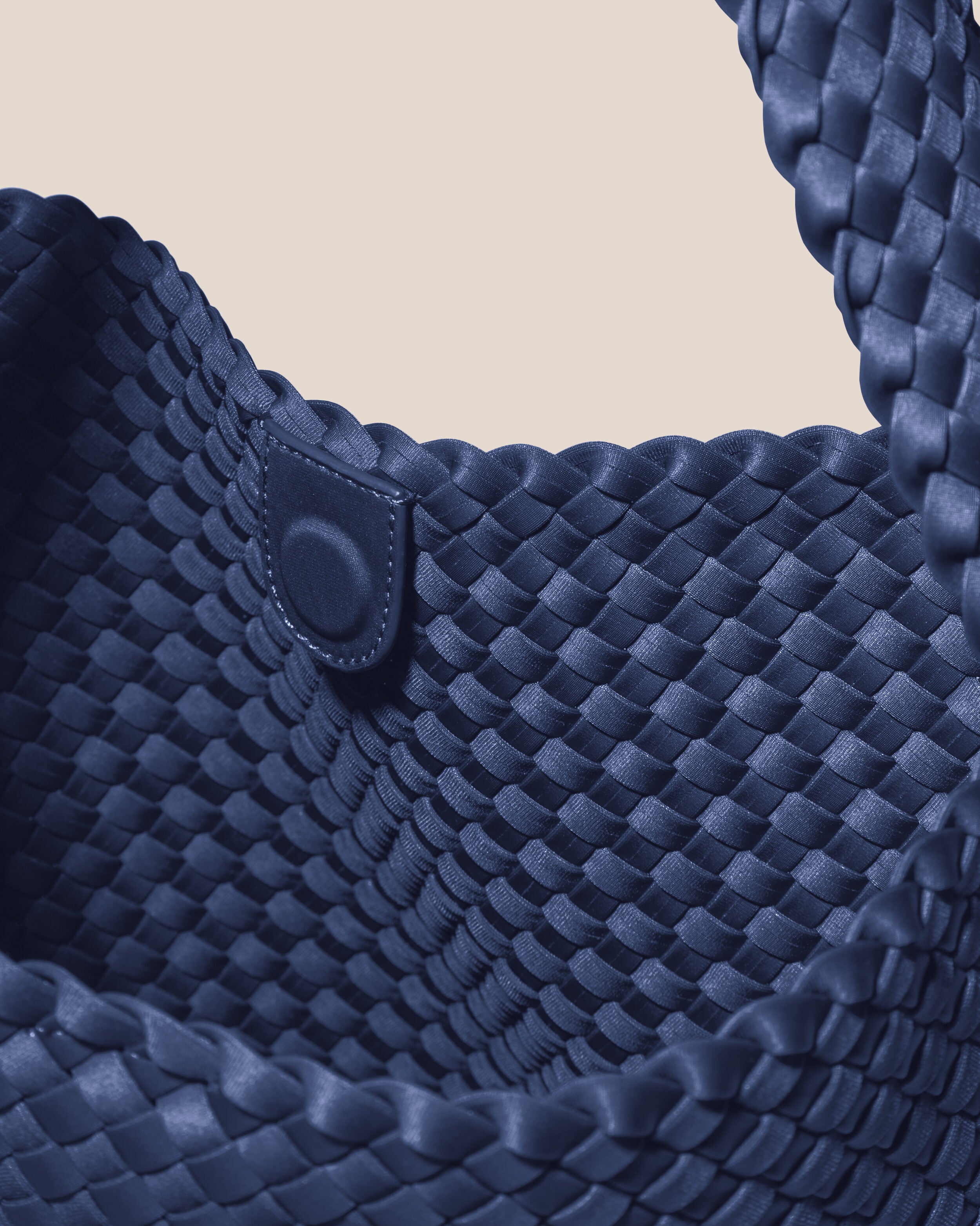 Interior close-up of Nomad Hobo in Ink Blue showing its open top with magnetic snap closure, and unlined interior.