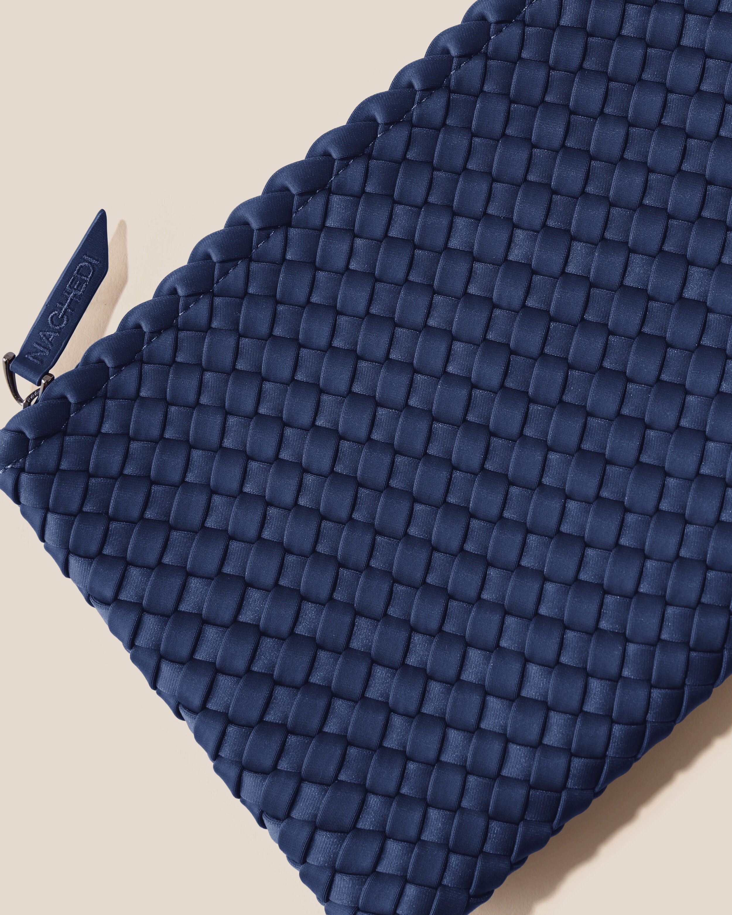 Close-up of included matching woven zippered pouch.