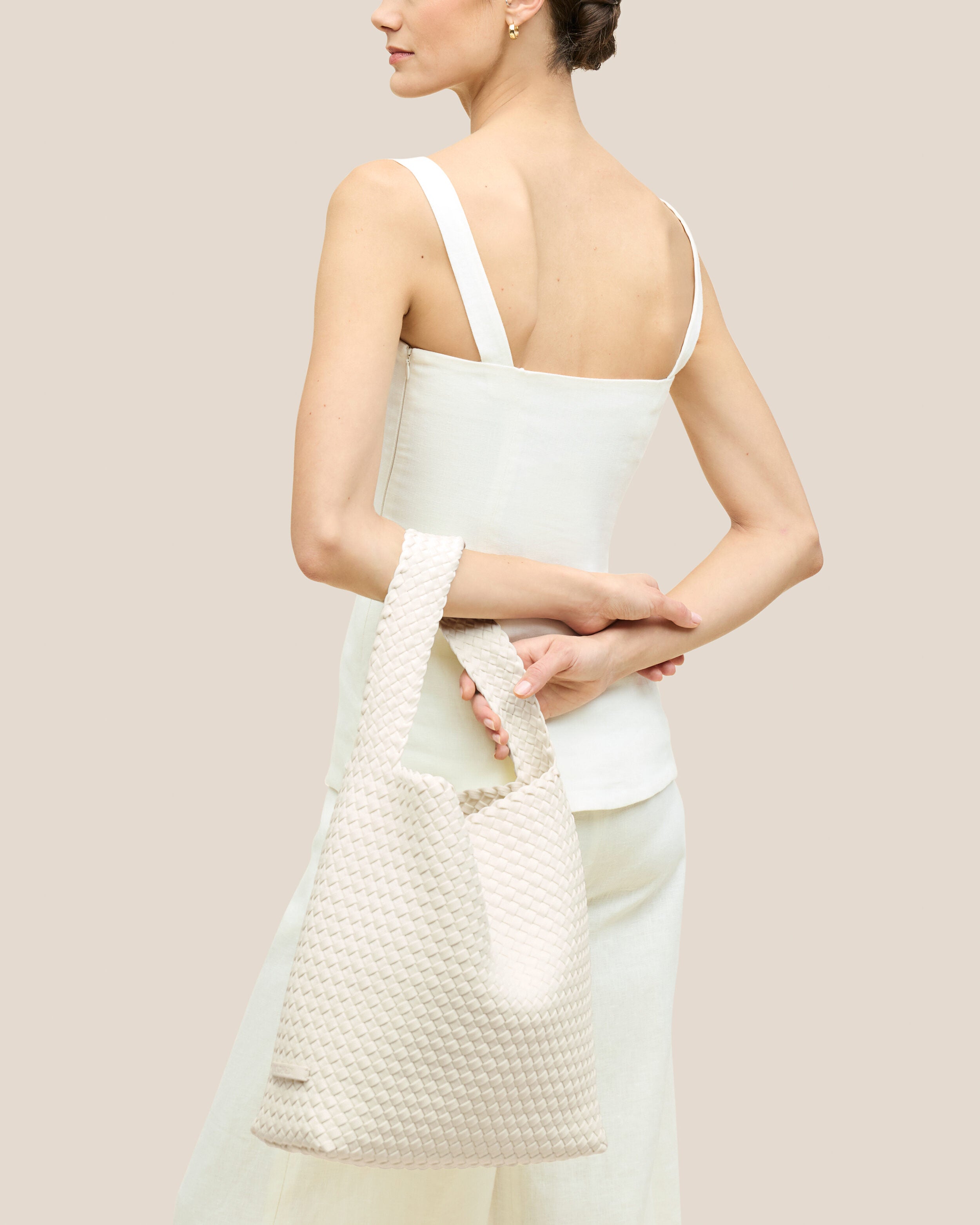 Nomad Hobo in Jasmine shown on model to illustrate scale and soft silhouette.