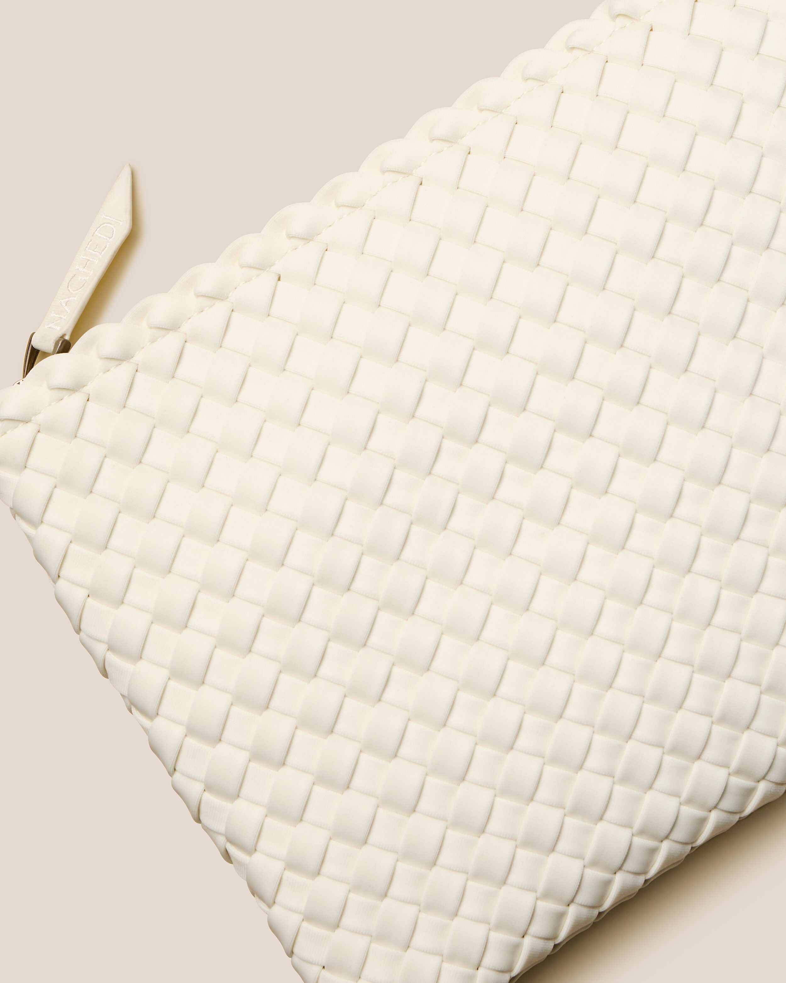 Close-up of included matching woven zippered pouch.
