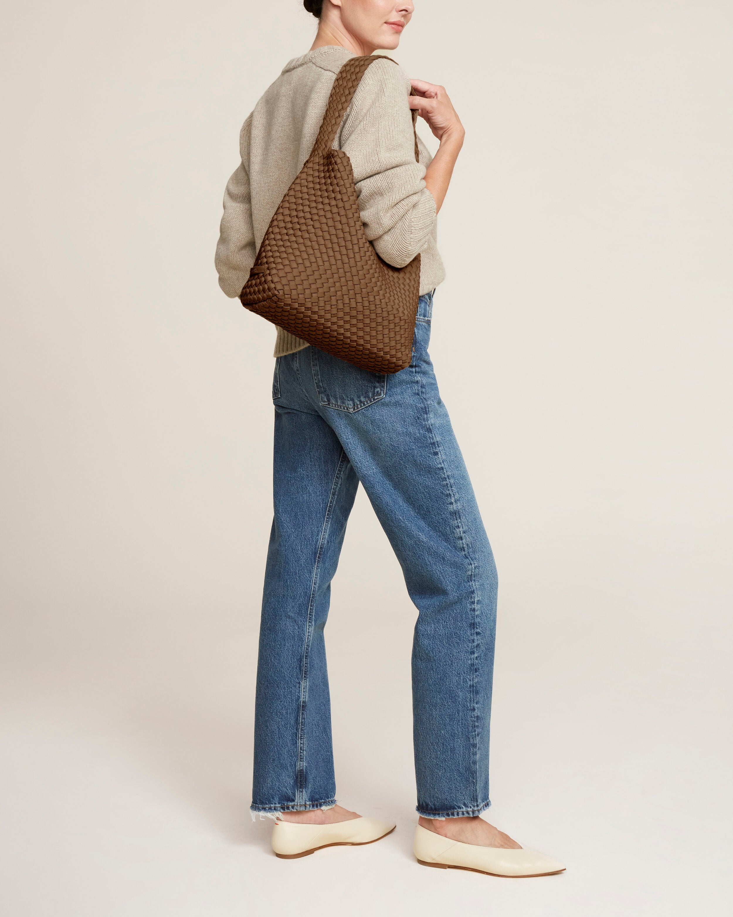 Nomad Hobo in Mink shown on model to illustrate scale and soft silhouette.