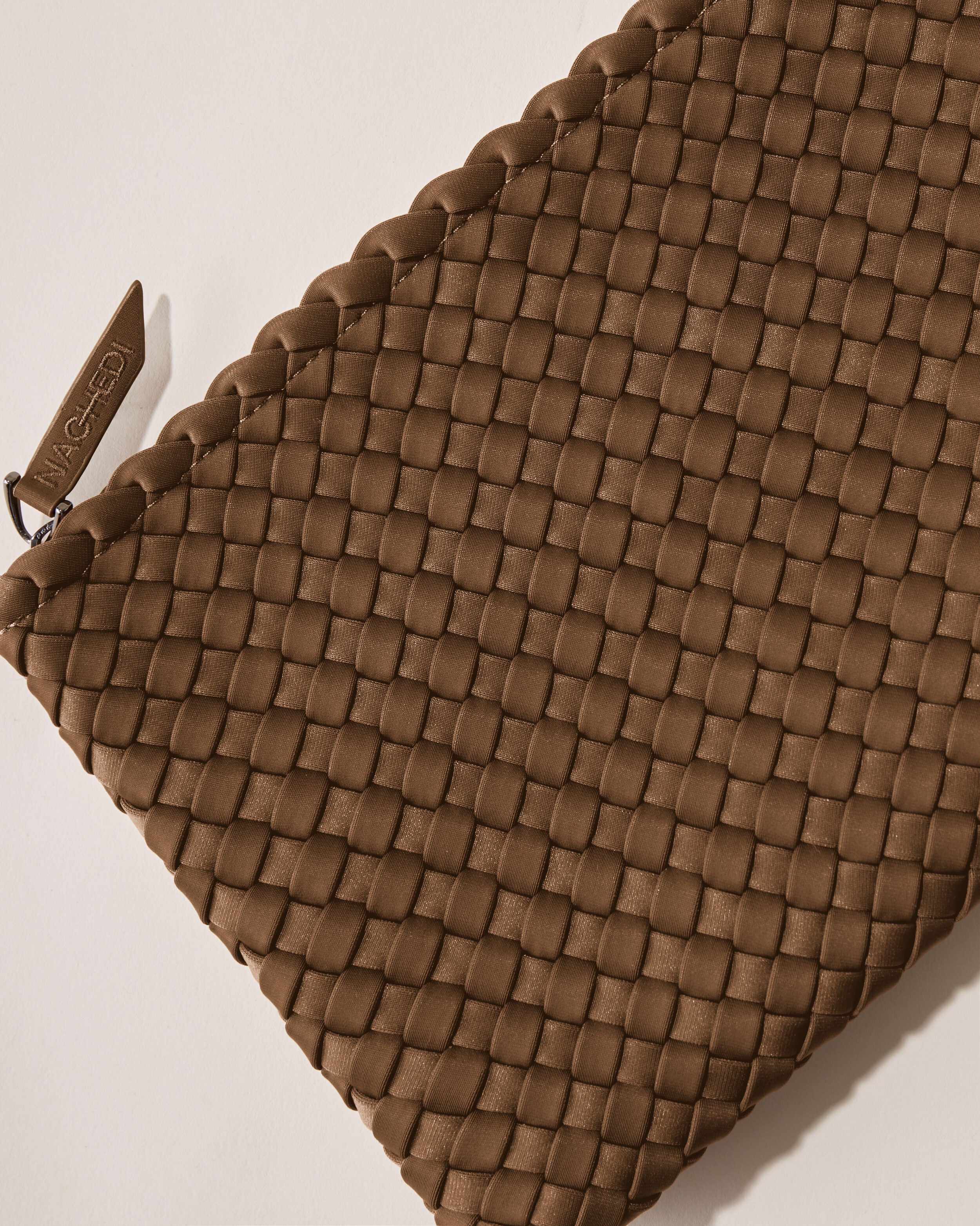 Close-up of included matching woven zippered pouch.