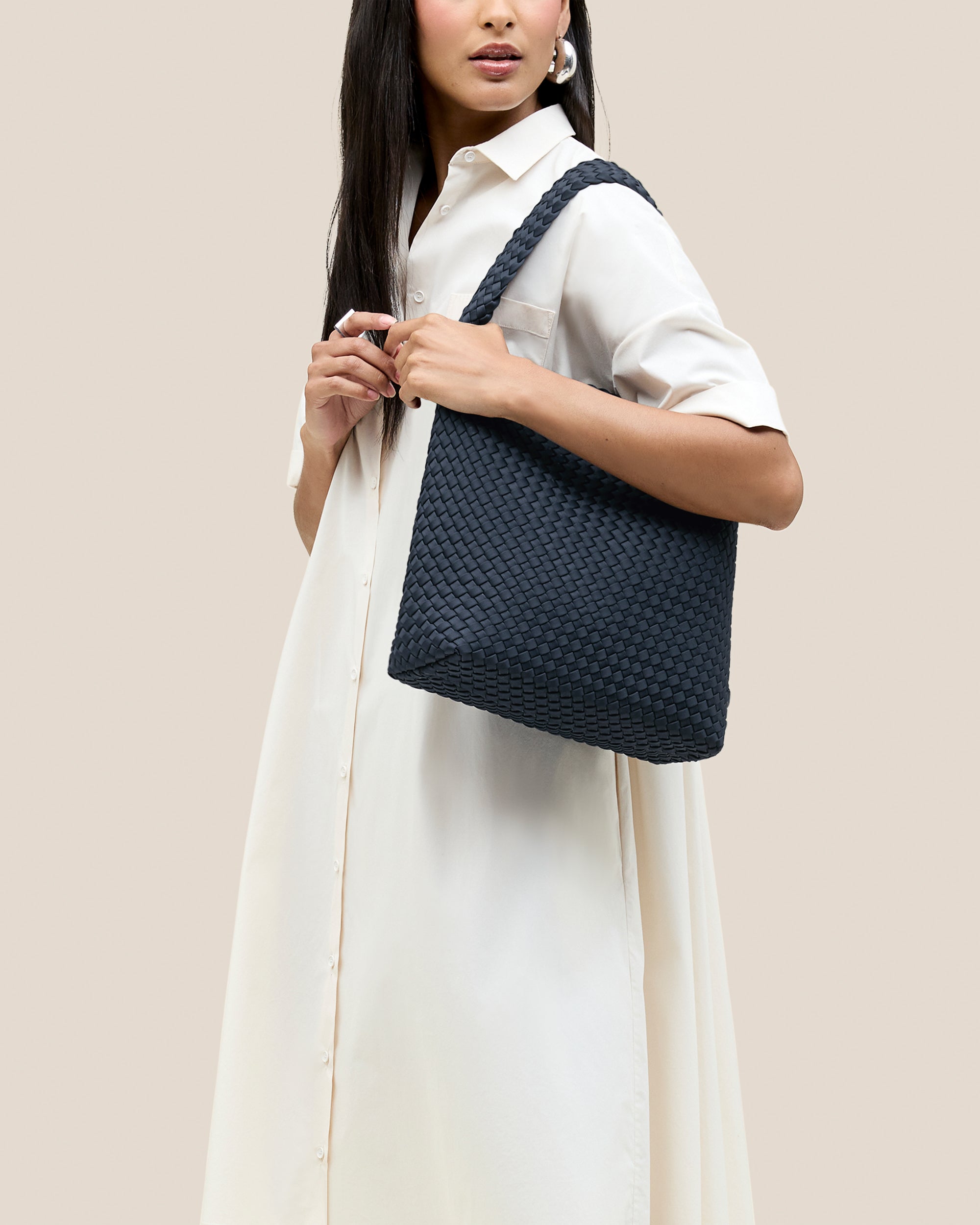 Nomad Hobo in Murano shown on model to illustrate scale and soft silhouette.