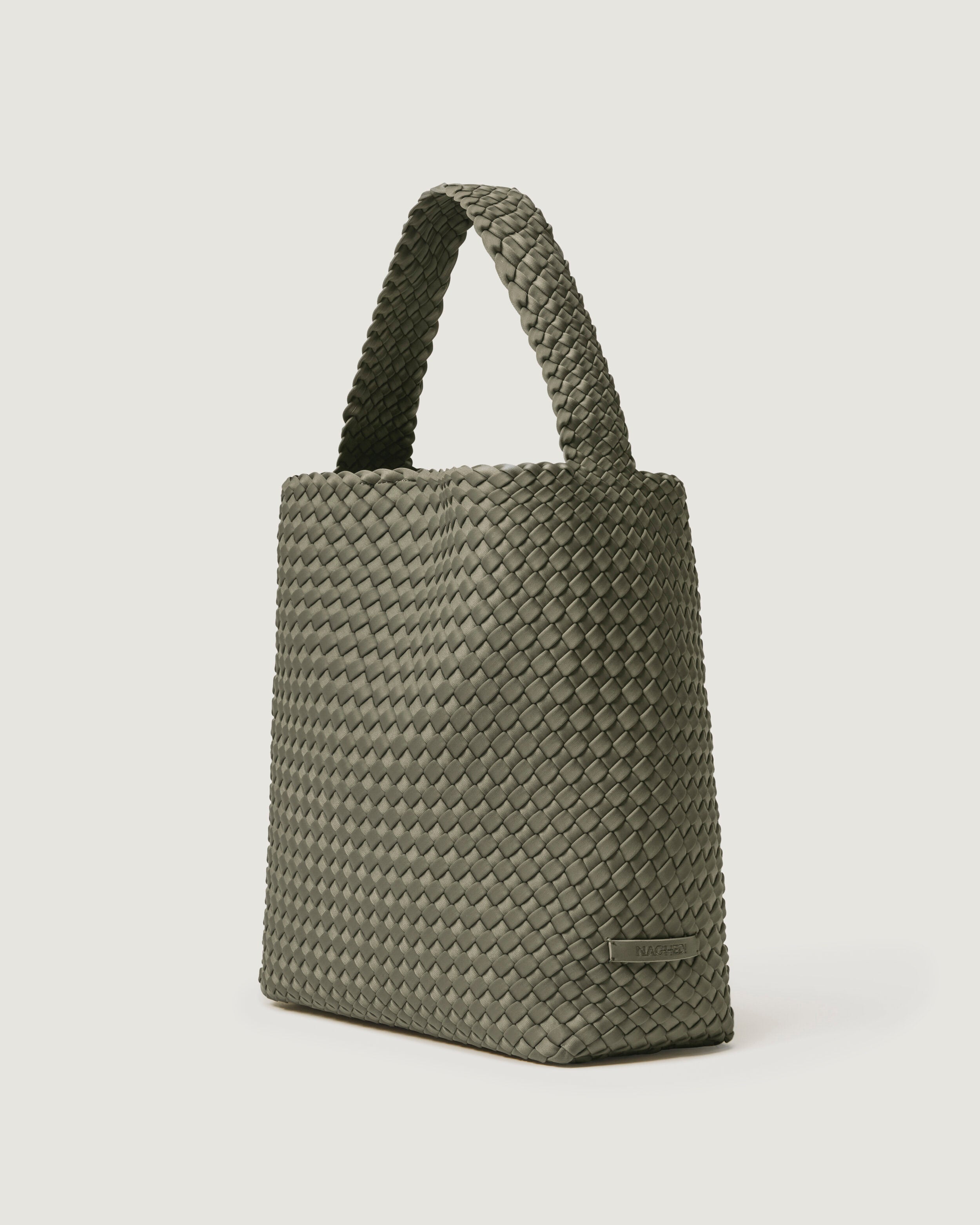 Nomad Hobo in Olea shown from a side angle, highlighting its handwoven neoprene construction and open top with magnetic snap closure.