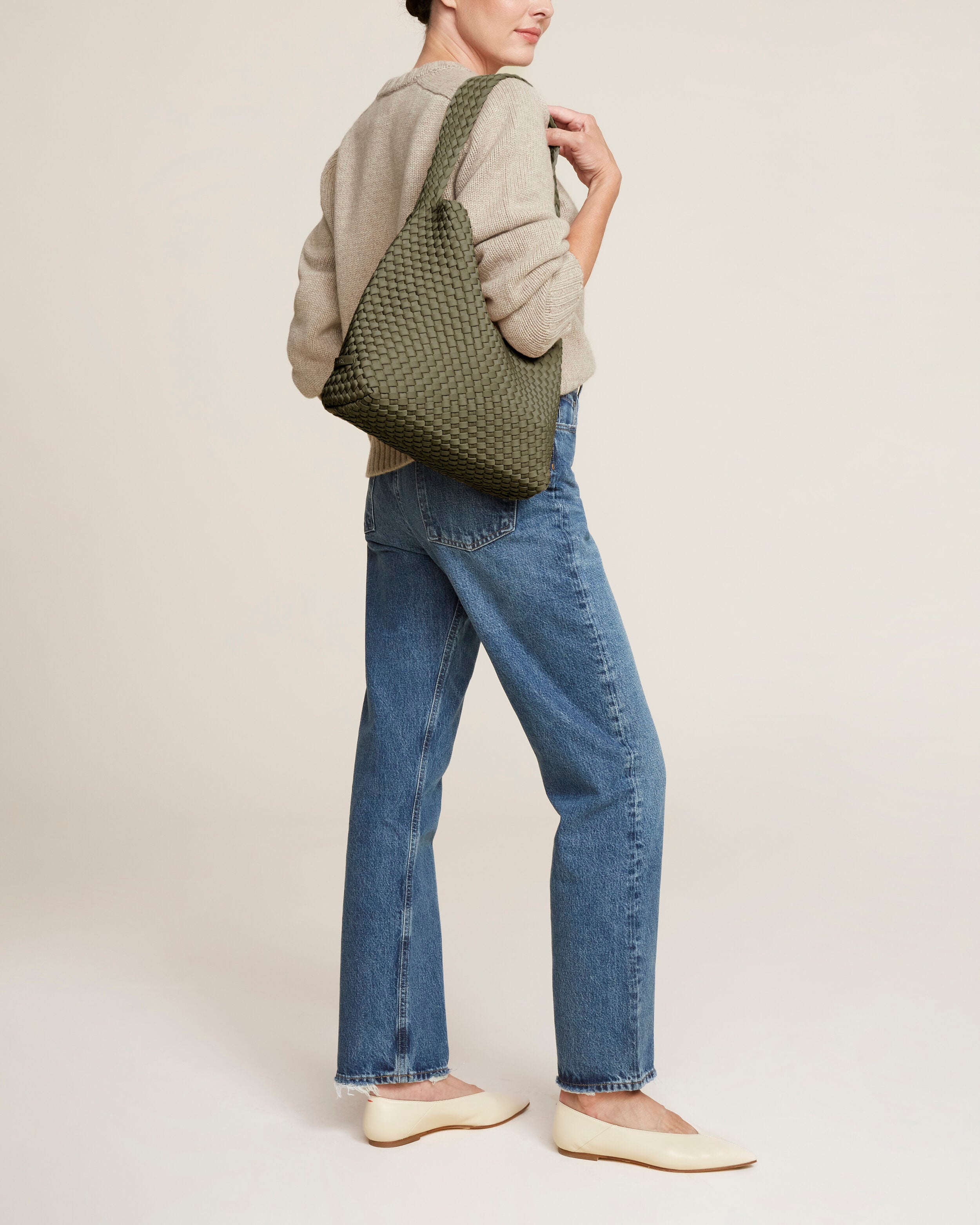 Nomad Hobo in Olive shown on model to illustrate scale and soft silhouette.