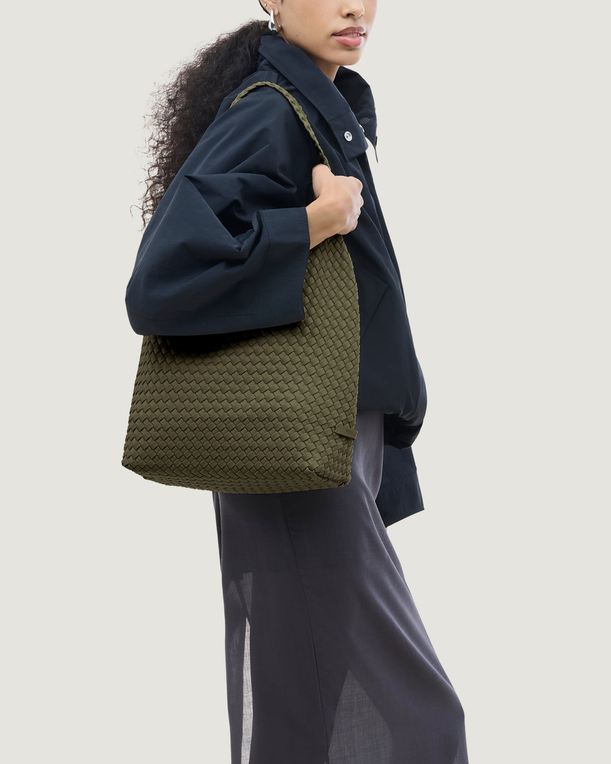 Nomad Hobo in Olive shown on model to illustrate scale and soft silhouette.