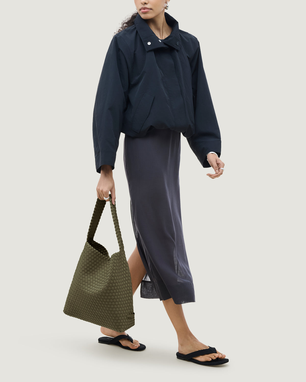 Nomad Hobo in Olive shown on model to illustrate scale and soft silhouette.