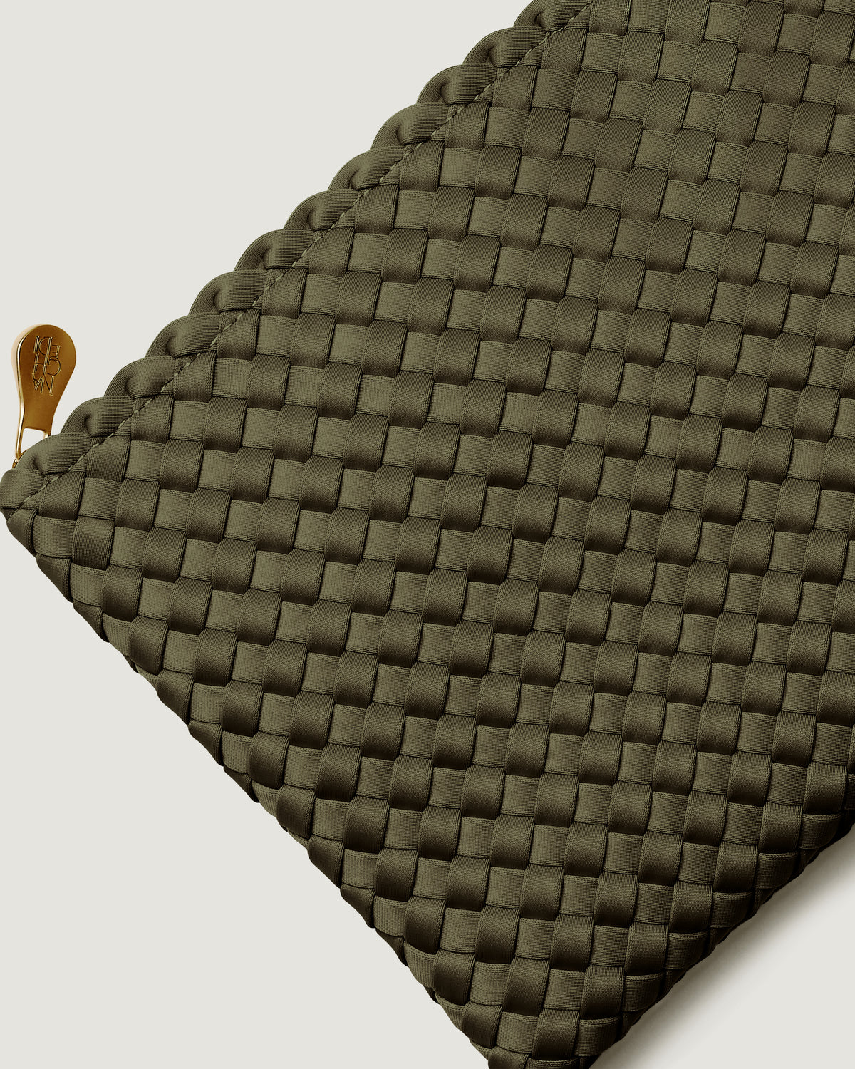 Close-up of included matching woven zippered pouch.