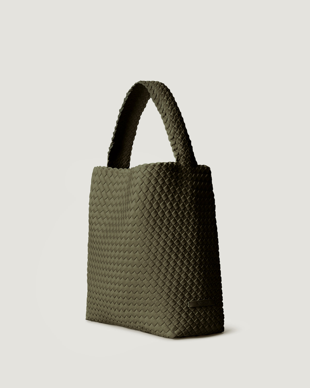 Nomad Hobo in Olive shown from a side angle, highlighting its handwoven neoprene construction and open top with magnetic snap closure.