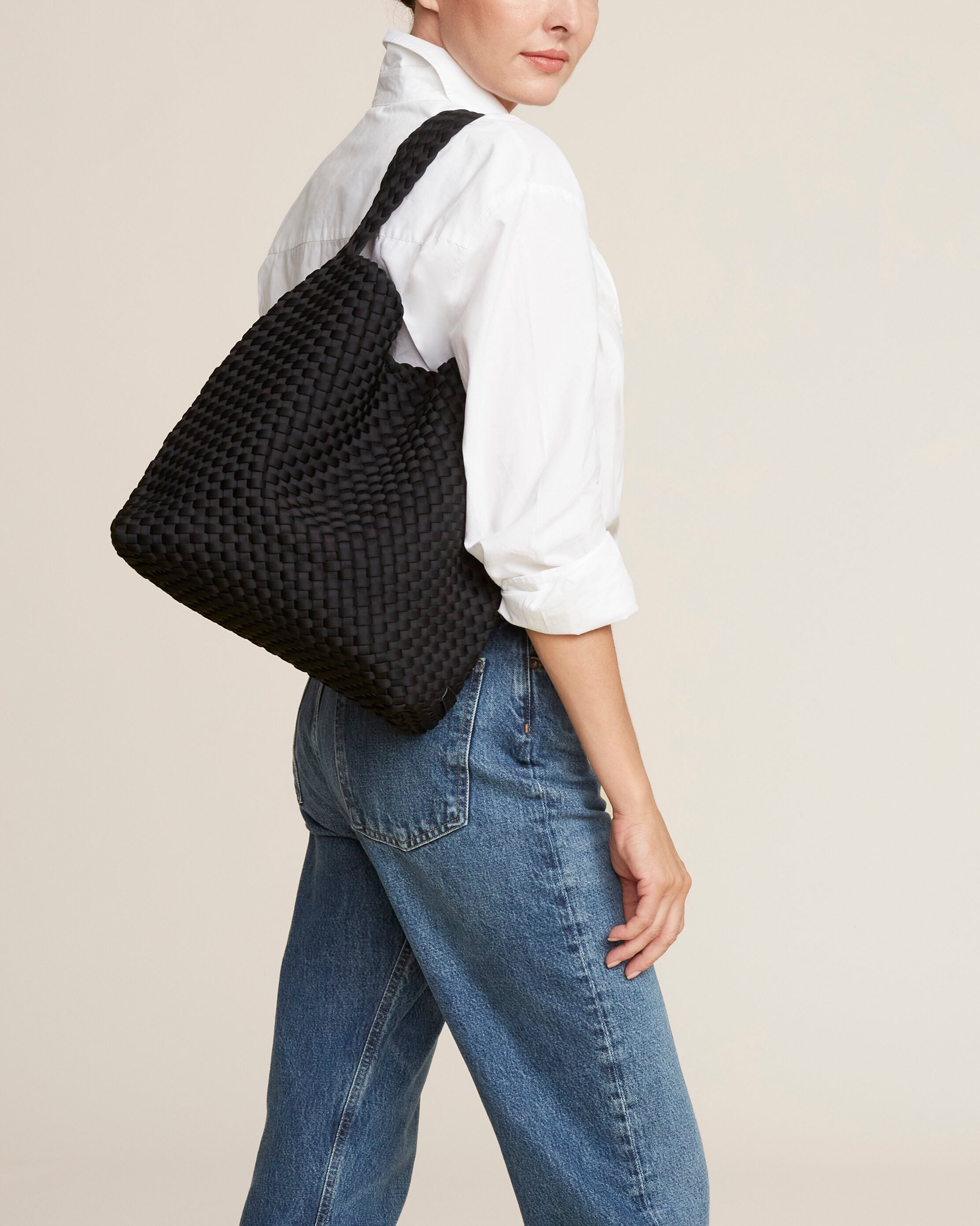 Nomad Hobo in Onyx shown on model to illustrate scale and soft silhouette.