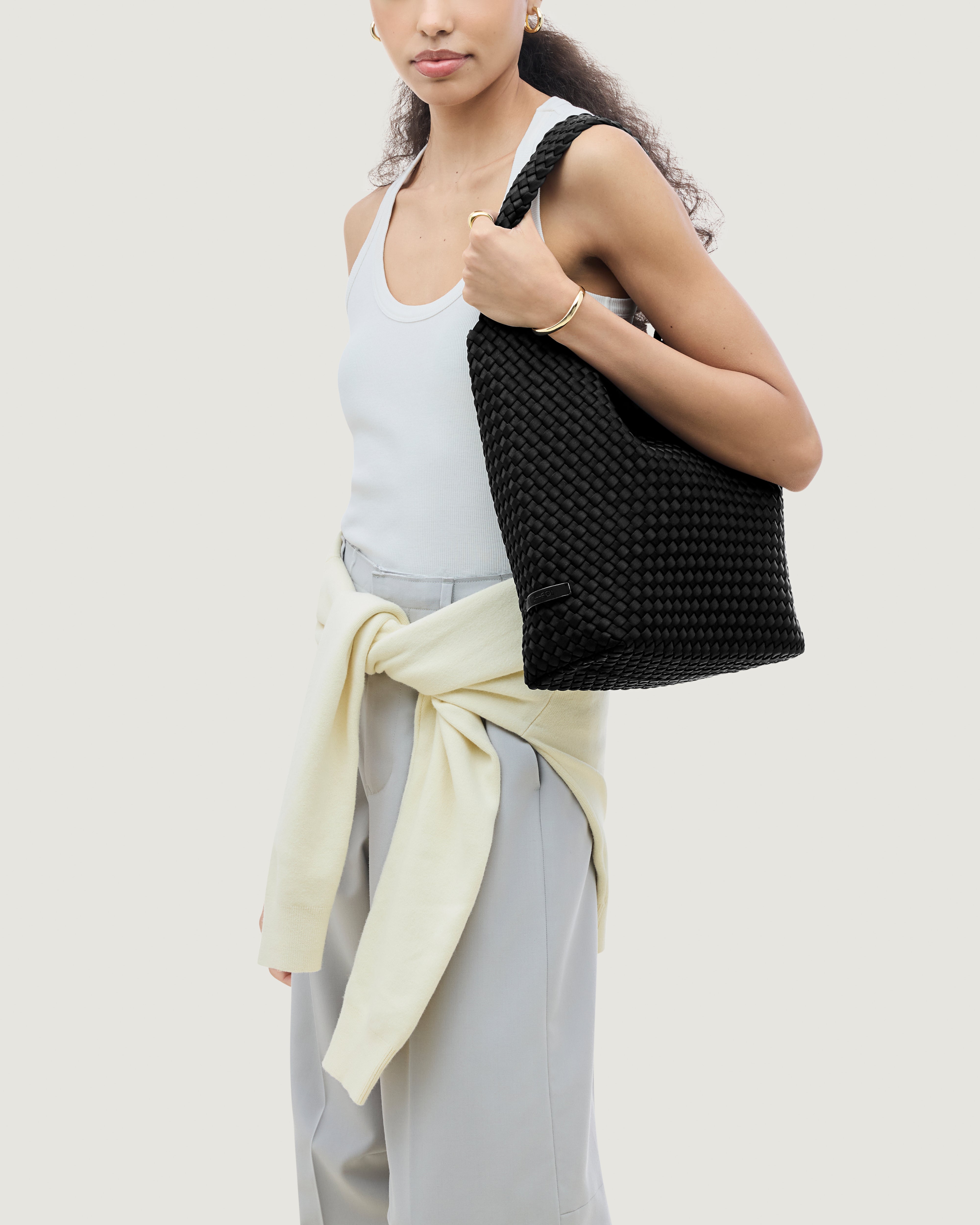 Nomad Hobo in Onyx shown on model to illustrate scale and soft silhouette.