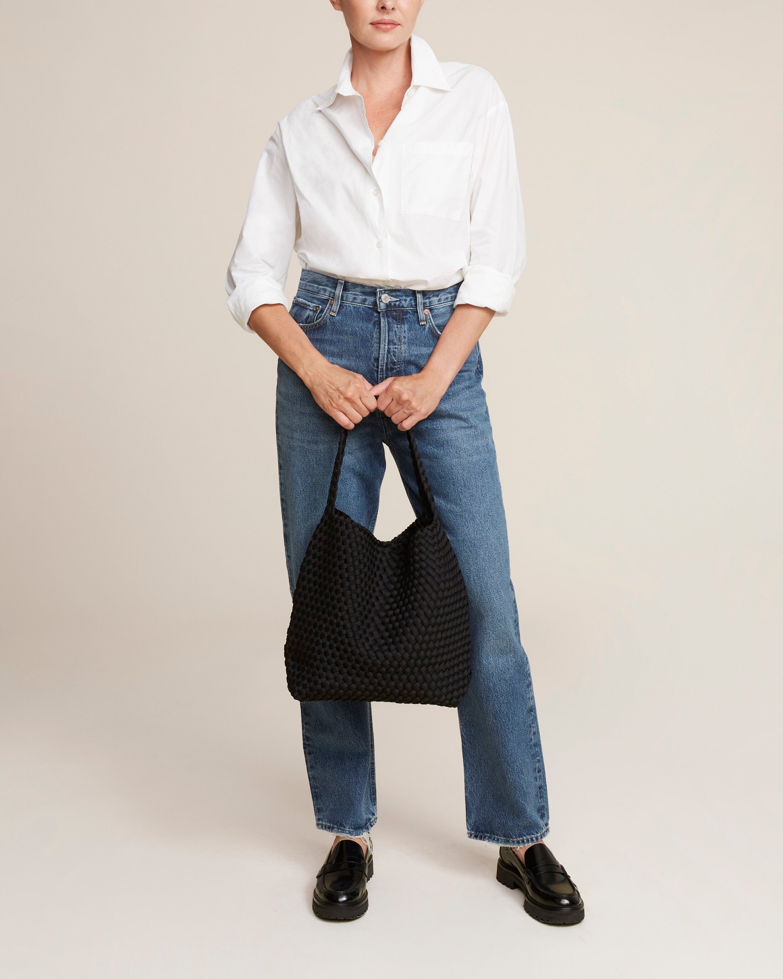 Nomad Hobo in Onyx shown on model to illustrate scale and soft silhouette.