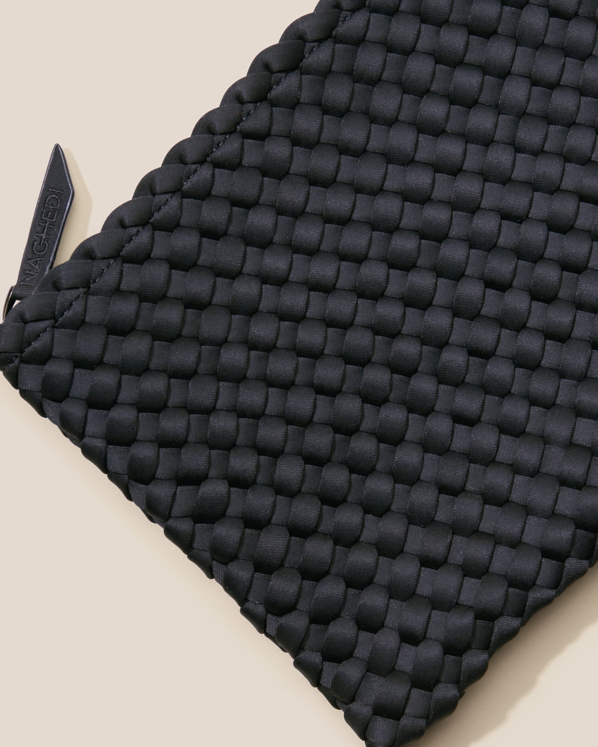 Close-up of included matching woven zippered pouch.