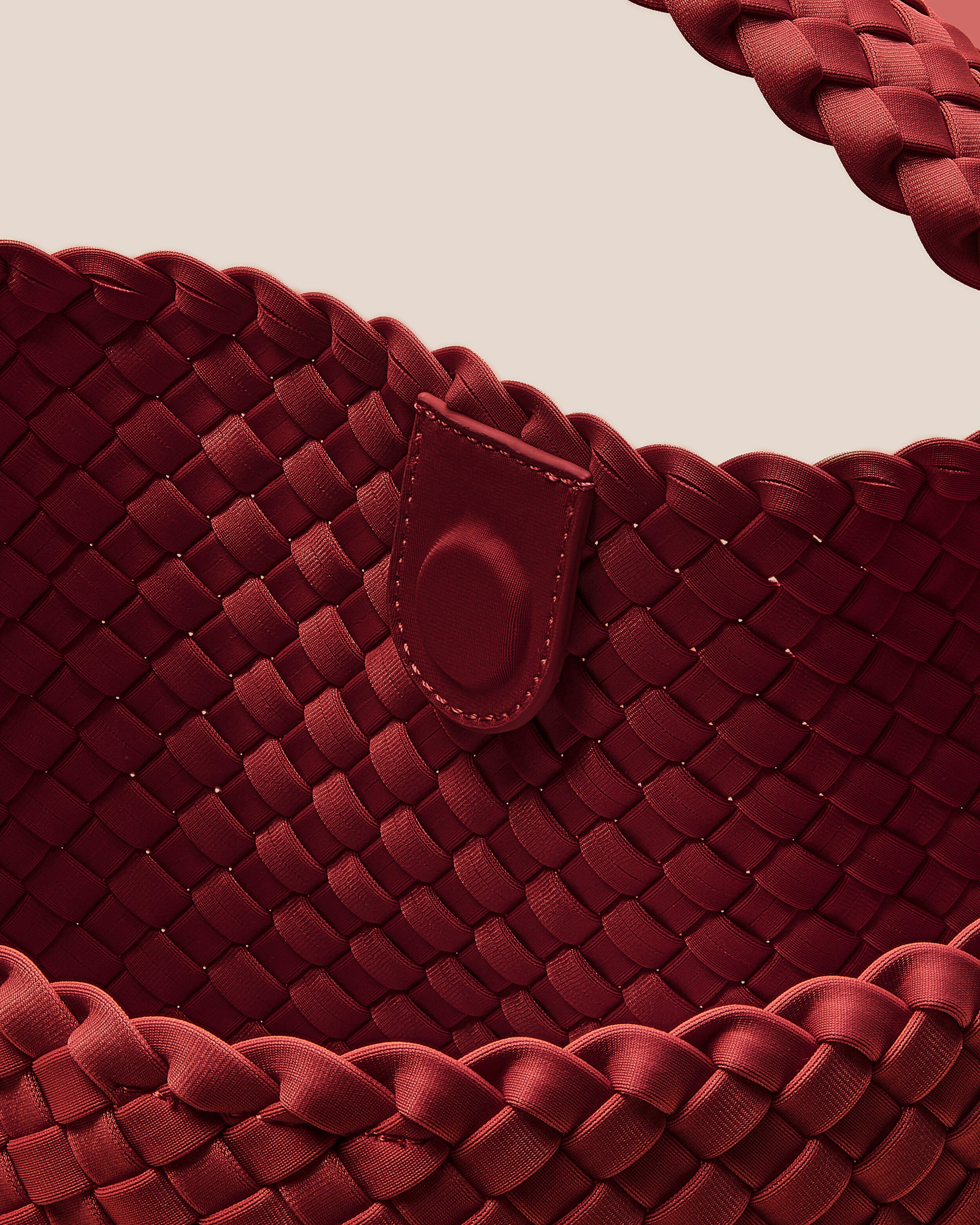 Interior close-up of Nomad Hobo in Rosso showing its open top with magnetic snap closure, and unlined interior.