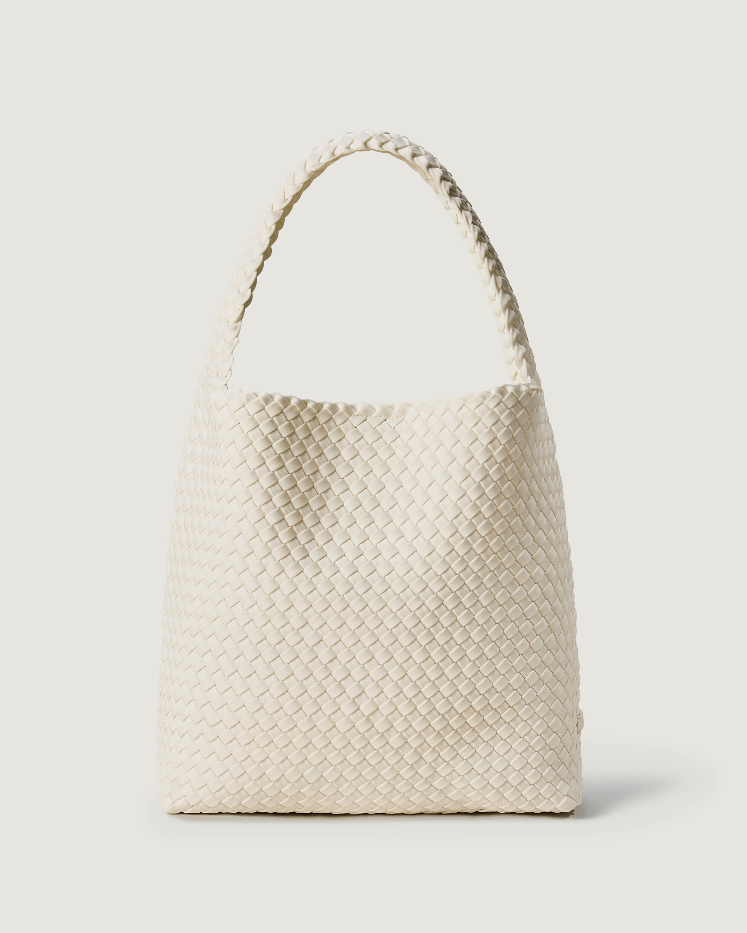 Nomad Hobo in Salt in handwoven neoprene, featuring an open top with magnetic snap closure, and handwoven shoulder strap lays comfortably flat.