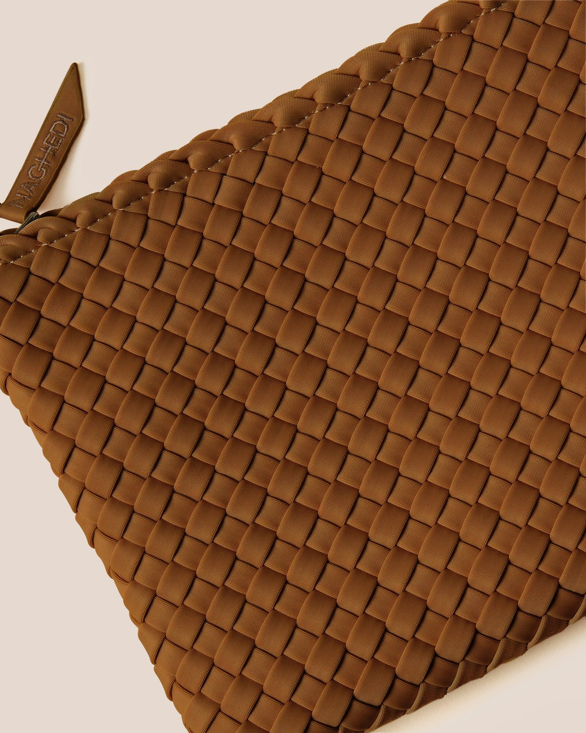 Close-up of included matching woven zippered pouch.